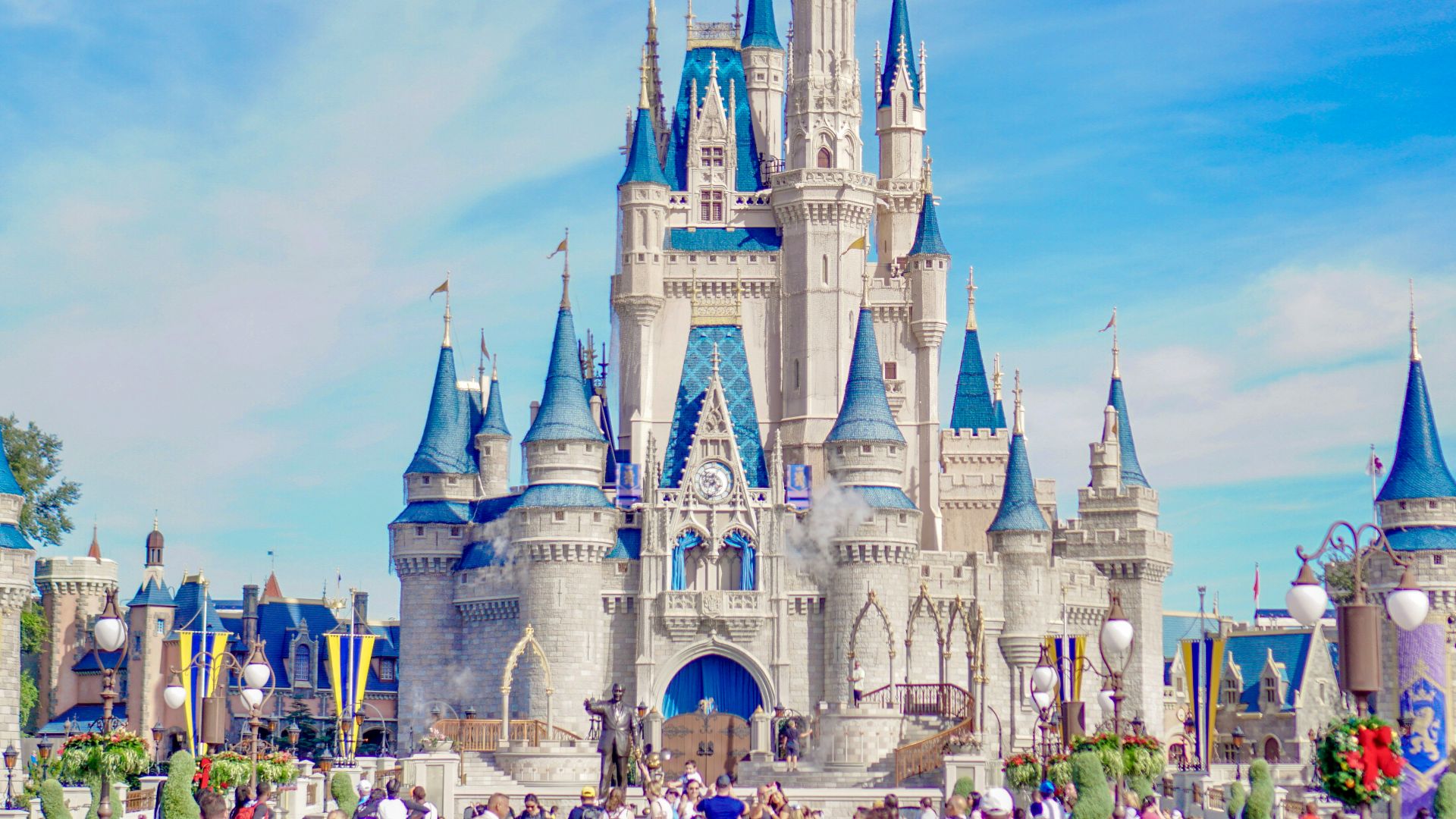 a large castle with a lot of people around it