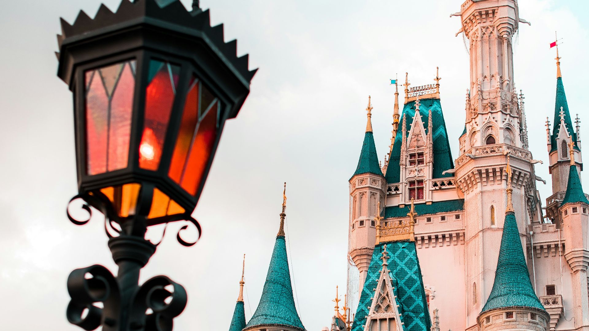 white and blue castle under cloudy sky during daytime
