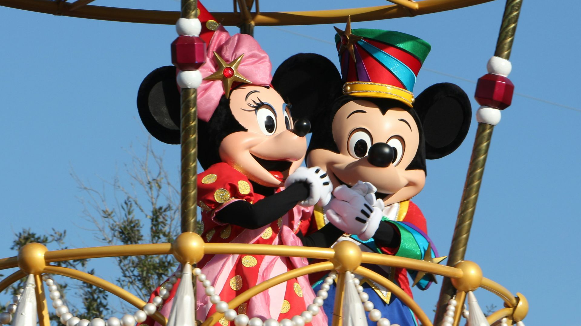 mickey mouse riding on swing ride