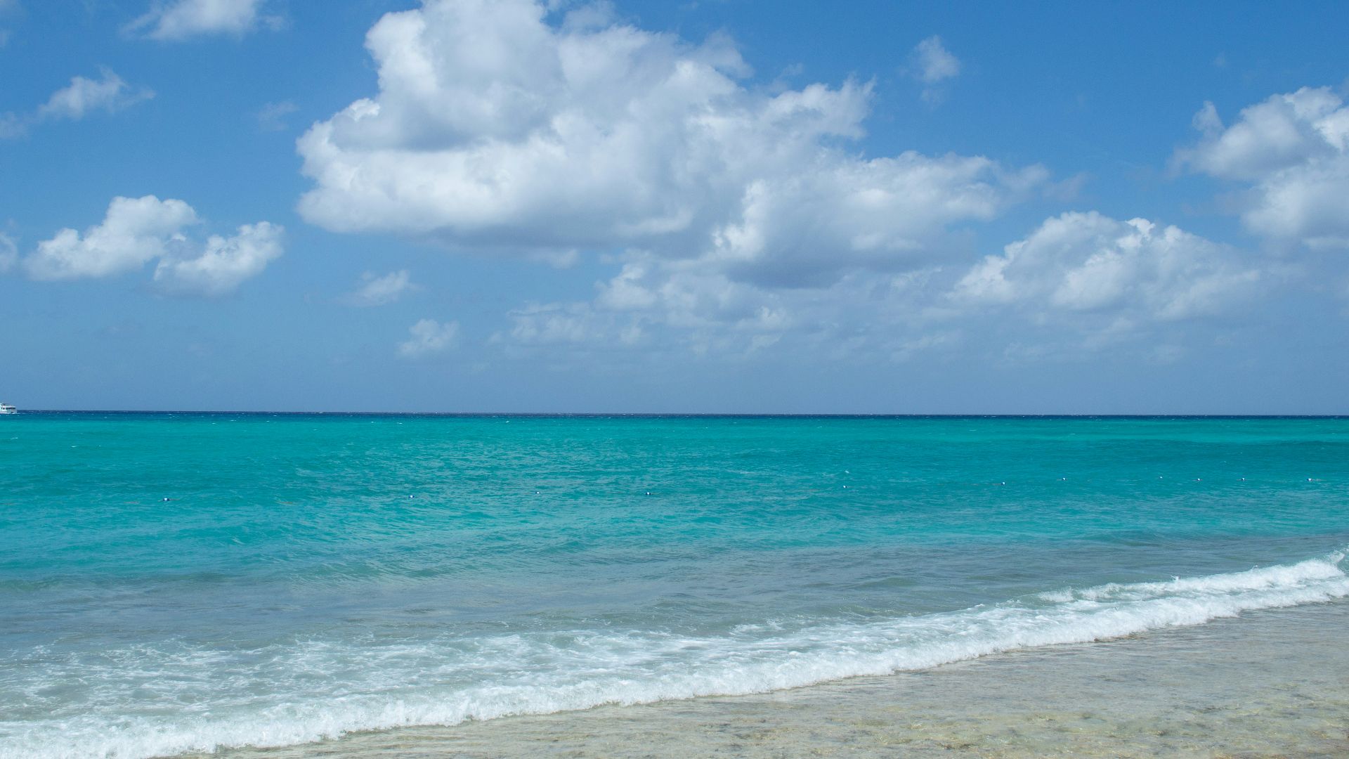 a boat is out in the ocean on a sunny day