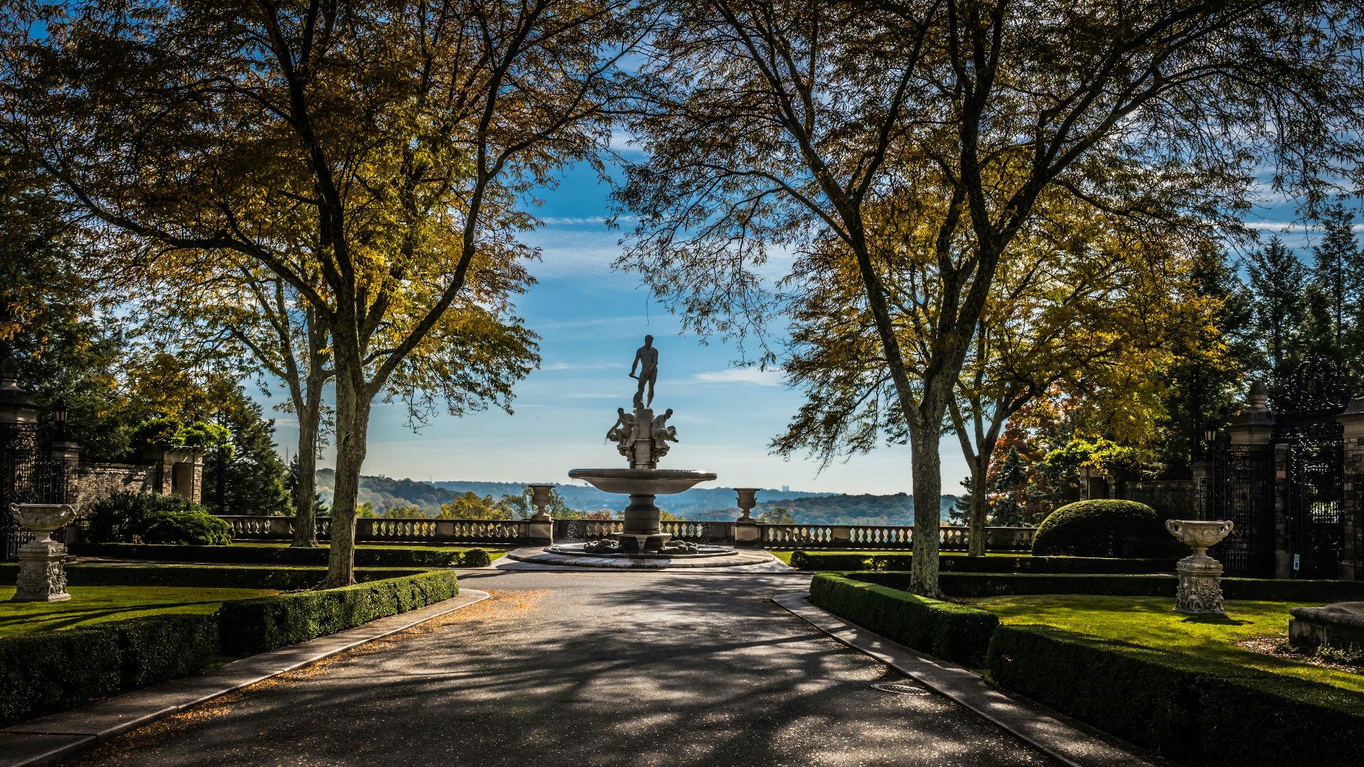 a road with a fountain in the middle of it