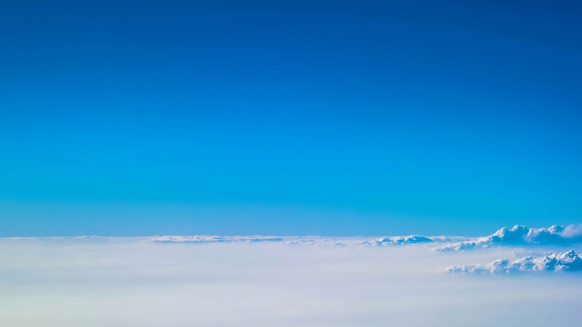 a view of the clouds from a plane window