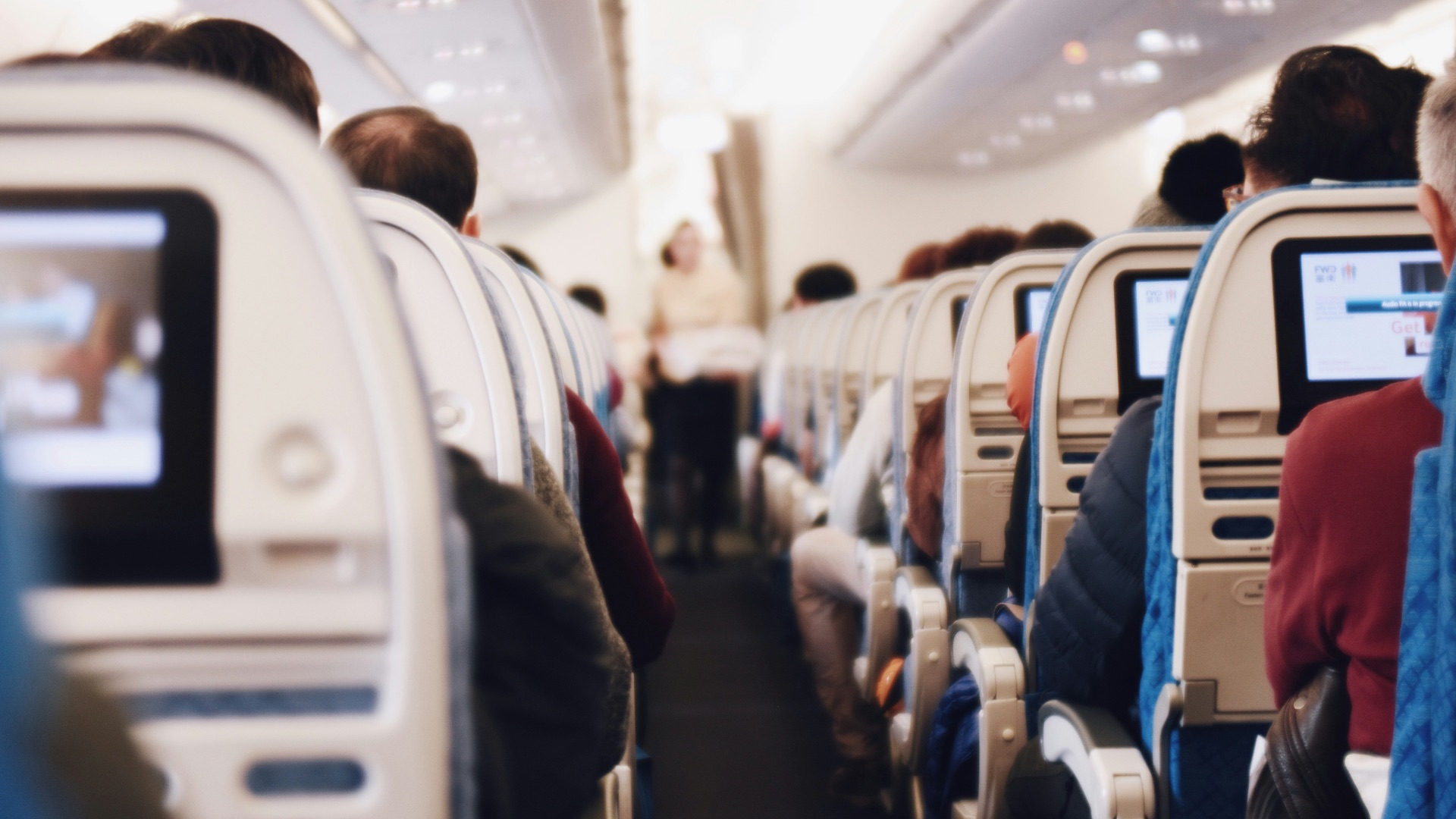 shallow focus photography of people inside of passenger plane