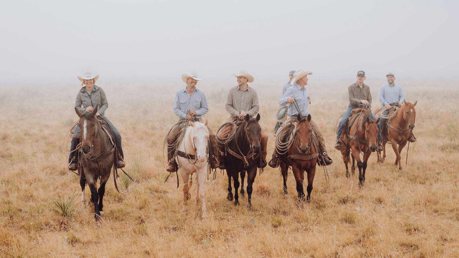 a group of men riding on the backs of horses