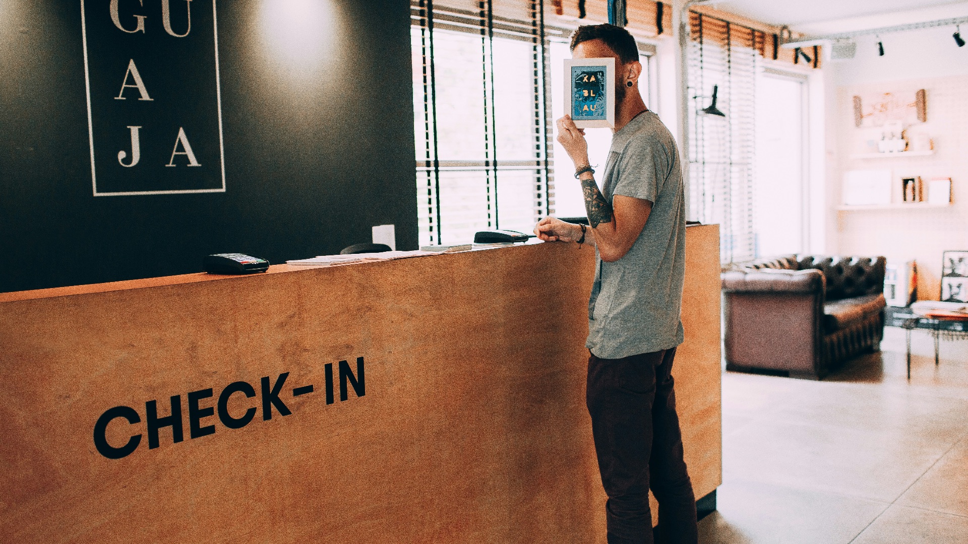 man standing beside counter