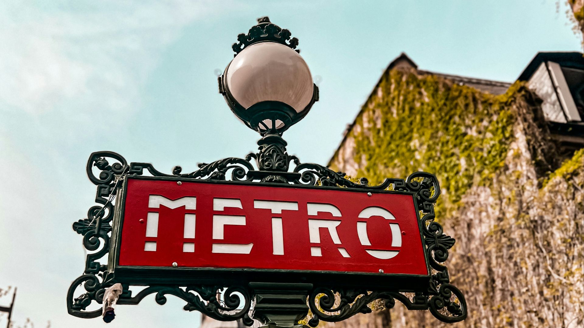 a red street sign sitting on top of a metal pole