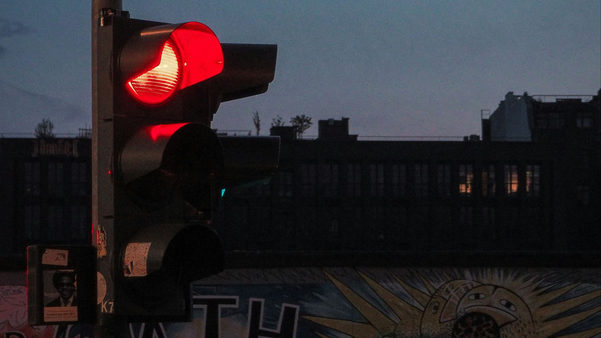 a traffic light sitting on the side of a road