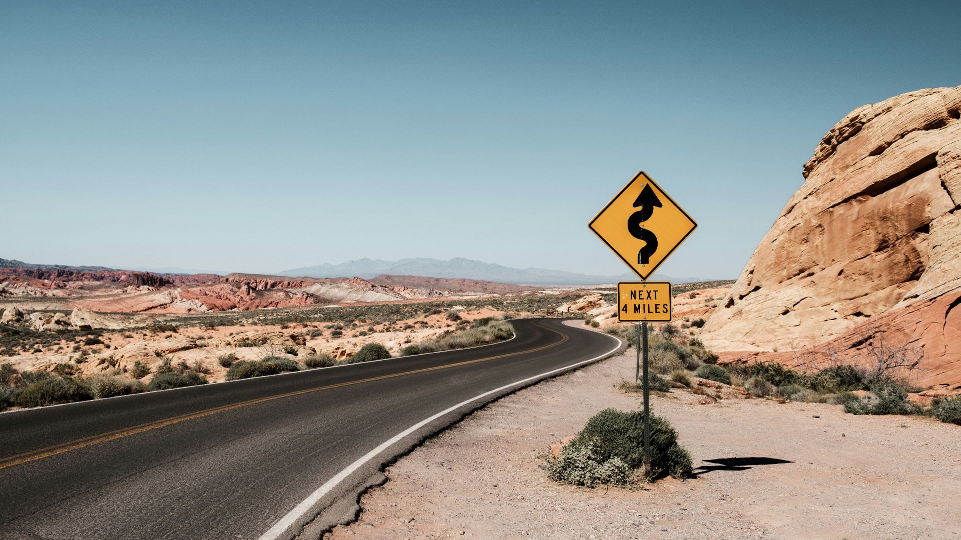 yellow and black zigzag signage