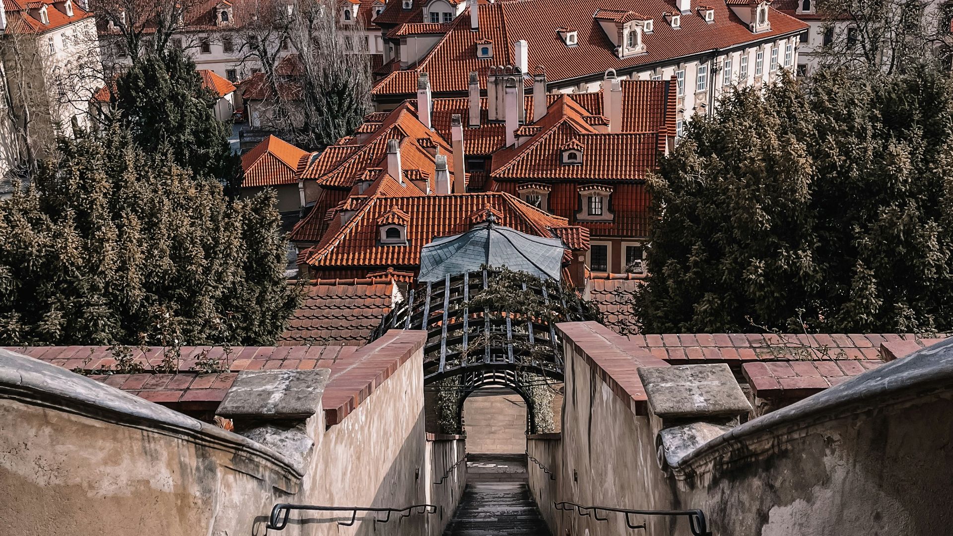 a stone bridge over a city