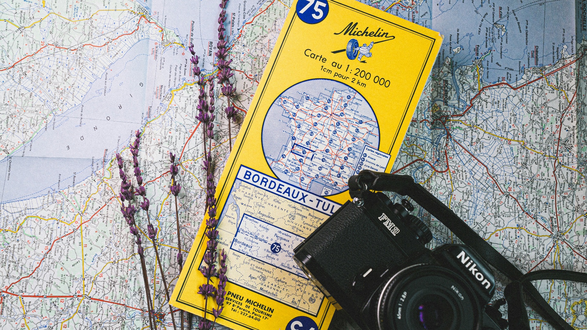 a camera and a map on a table