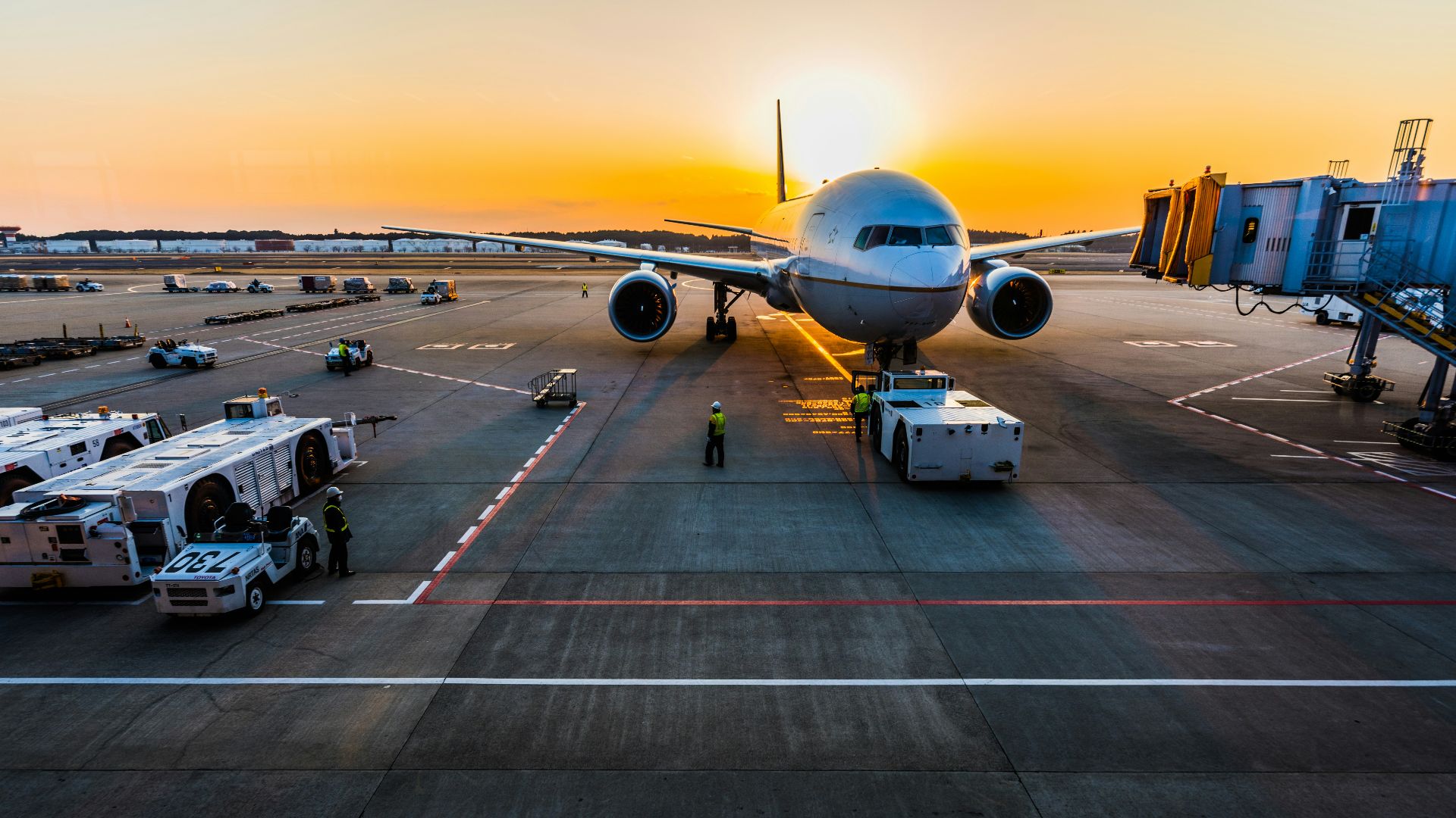 gray airplane on parking