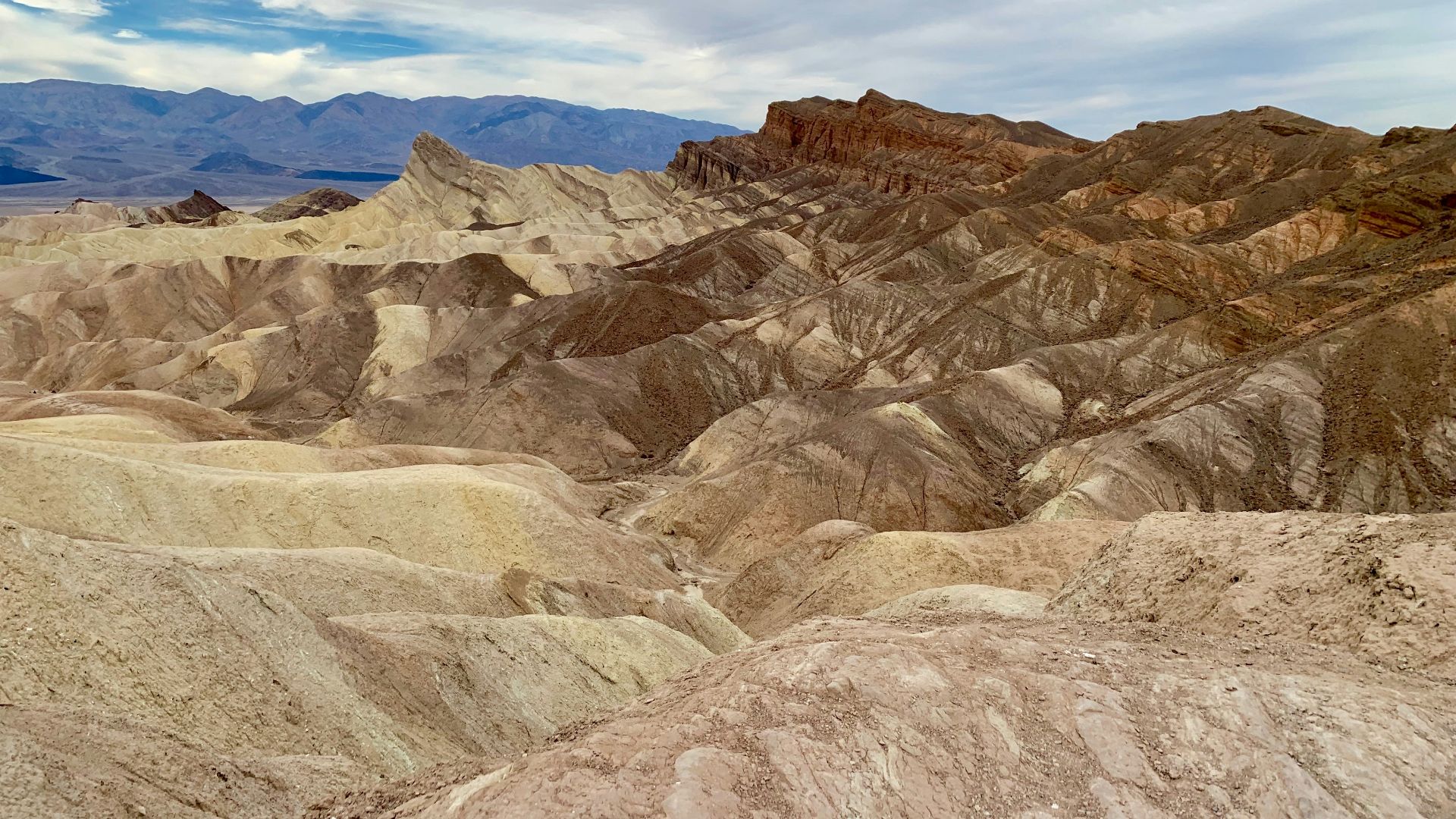 a view of a mountain range in the desert