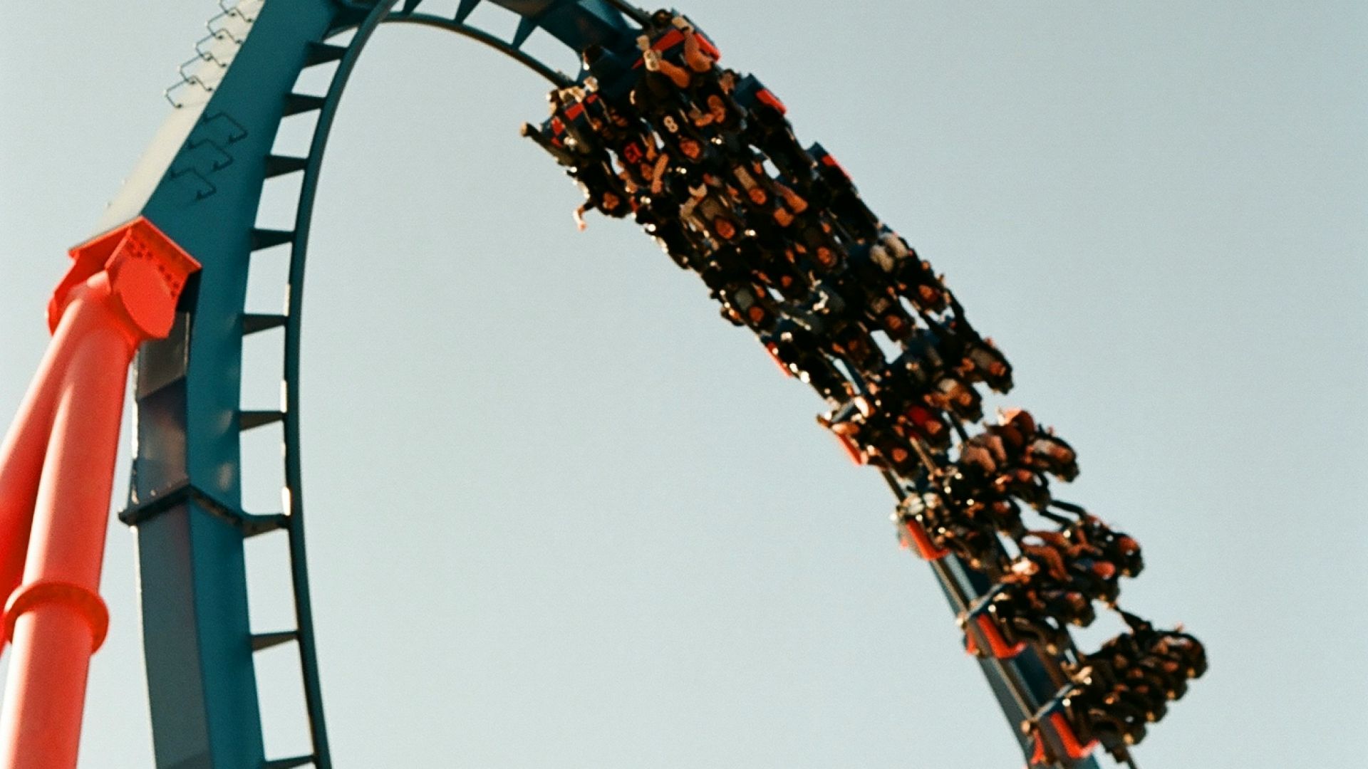 a roller coaster with people riding it
