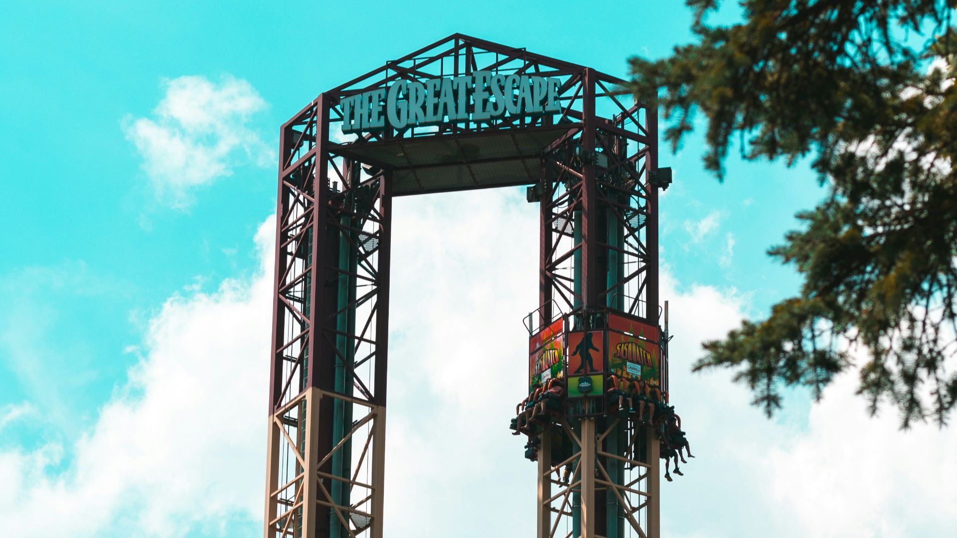 grey concrete tower and trees during daytime