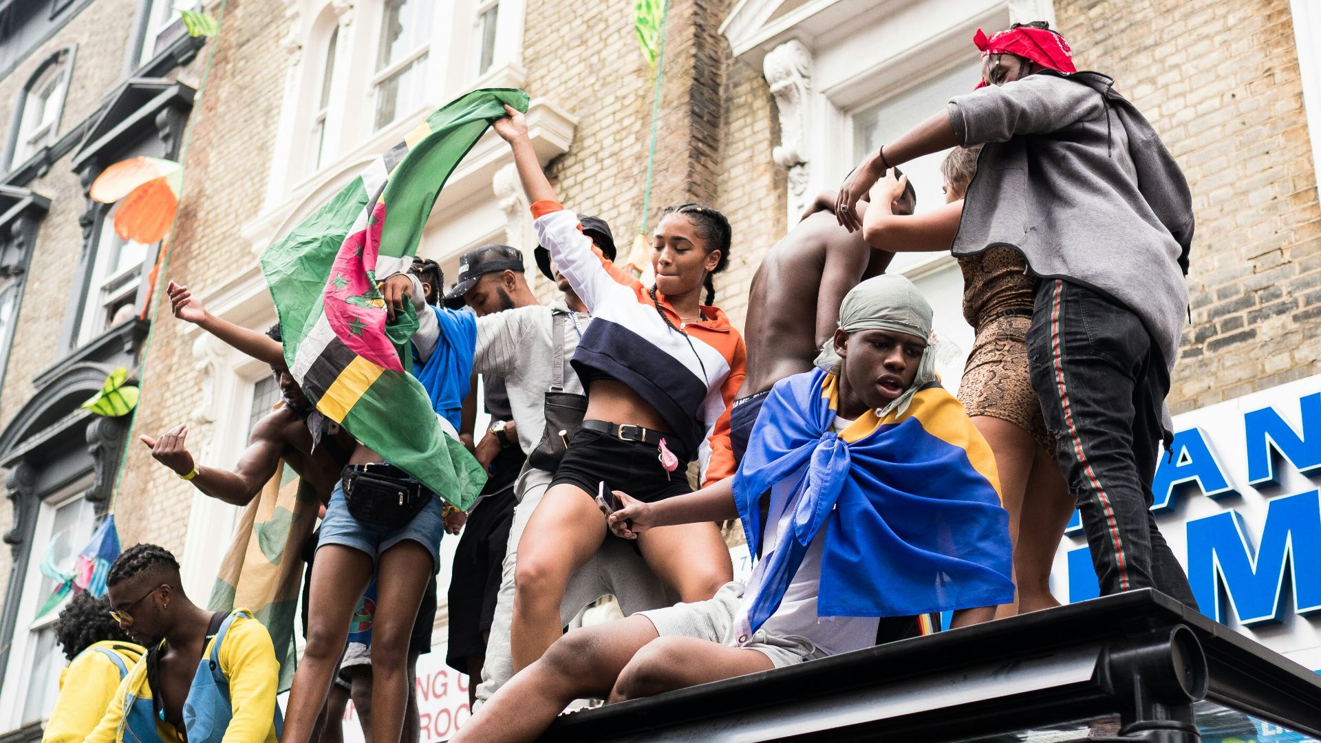 people standing on top of truck