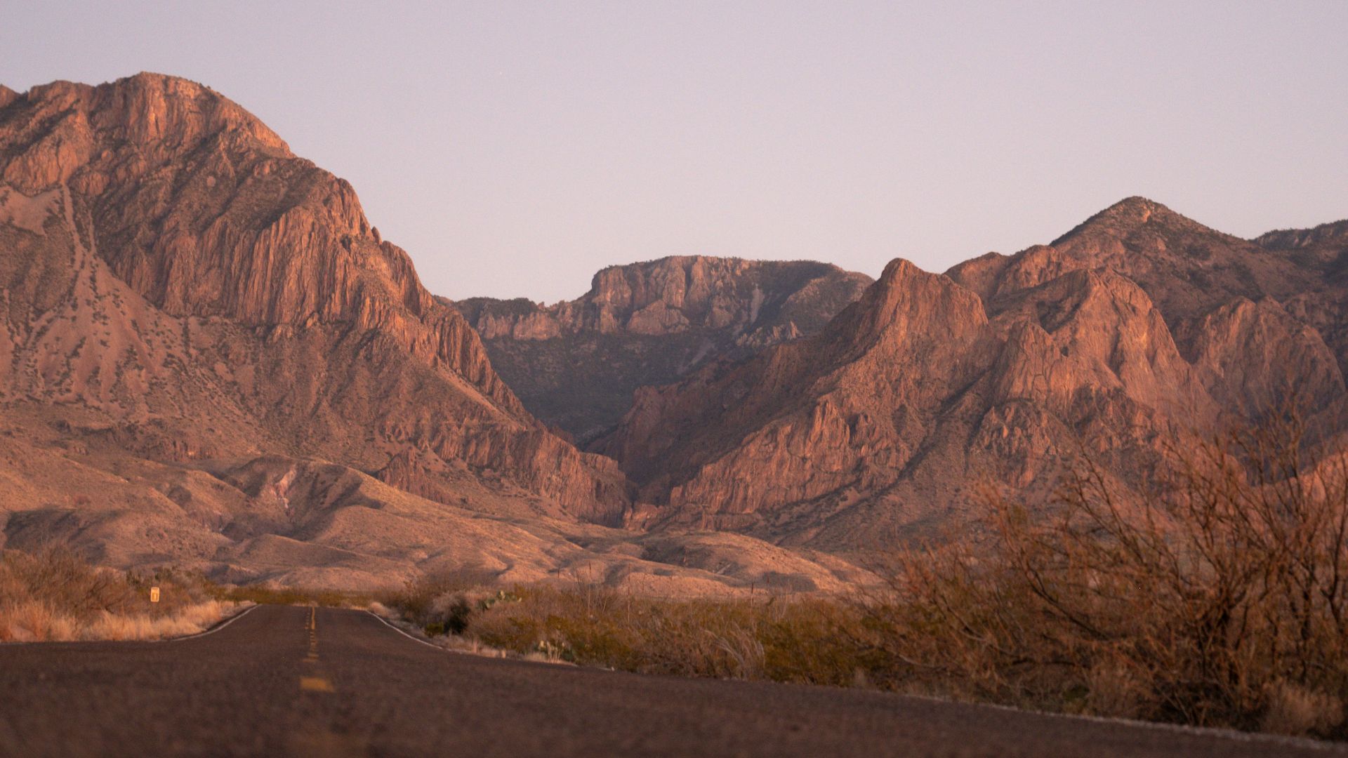 a view of a mountain range from a road