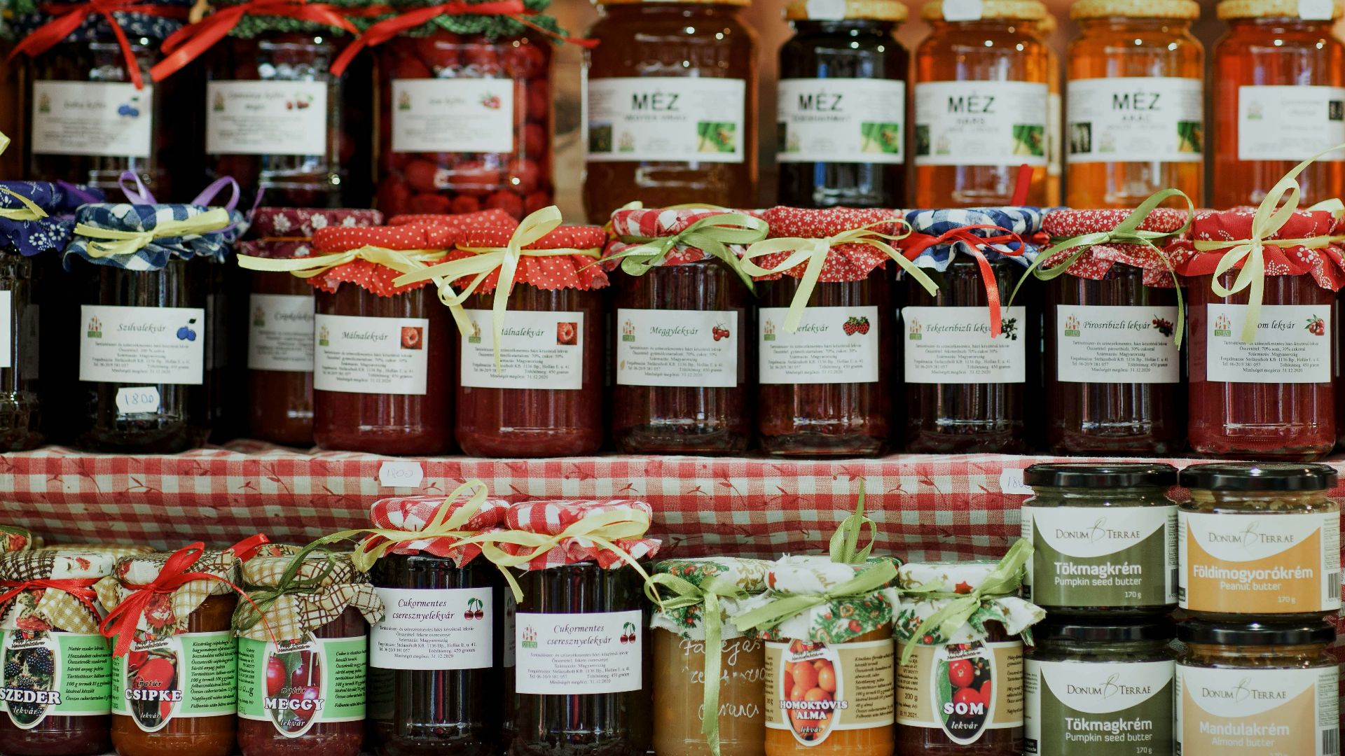 clear glass jars on brown wooden shelf