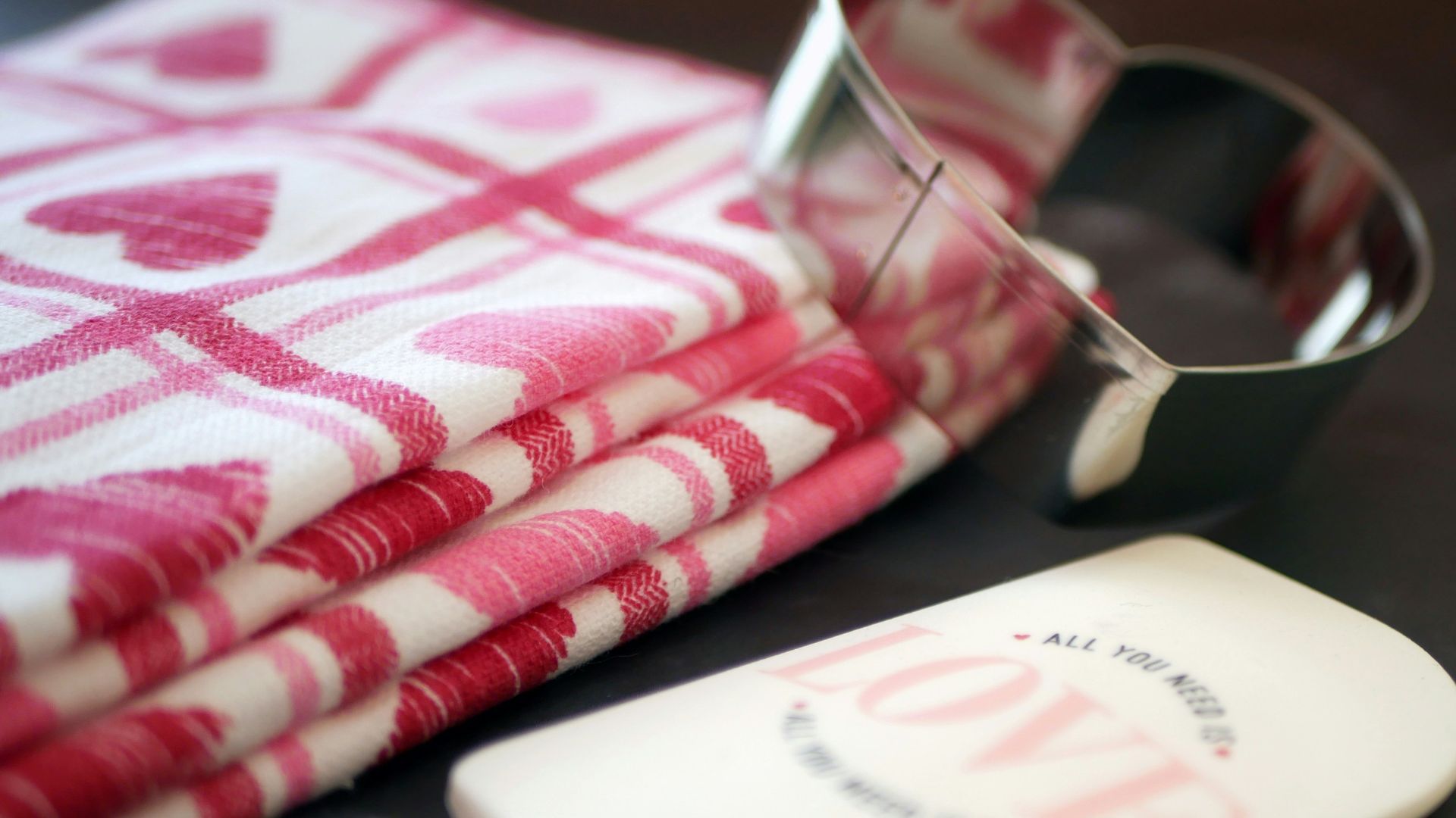 a pair of glasses sitting on top of a table next to a napkin