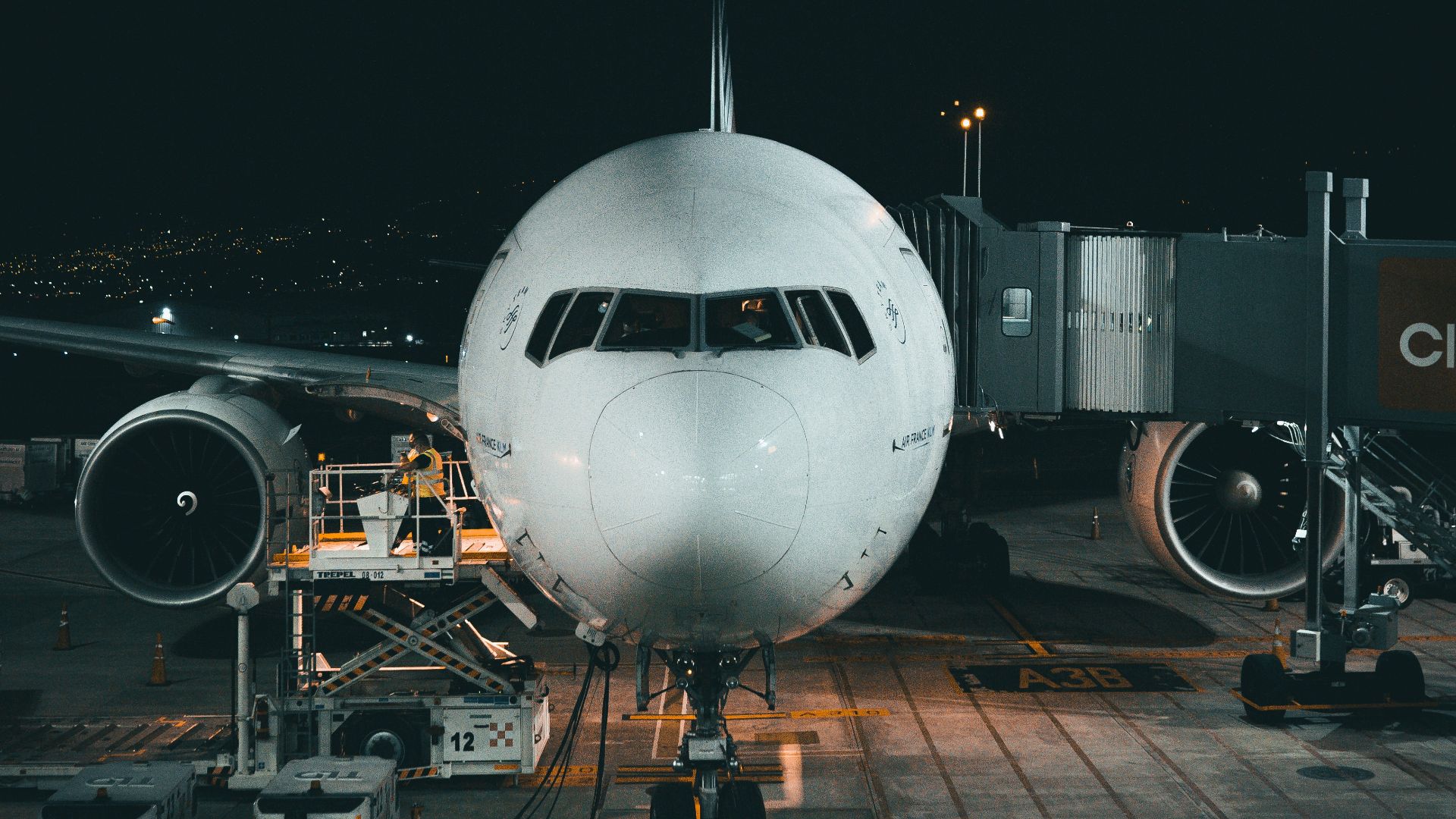 white airplane on airport during night time
