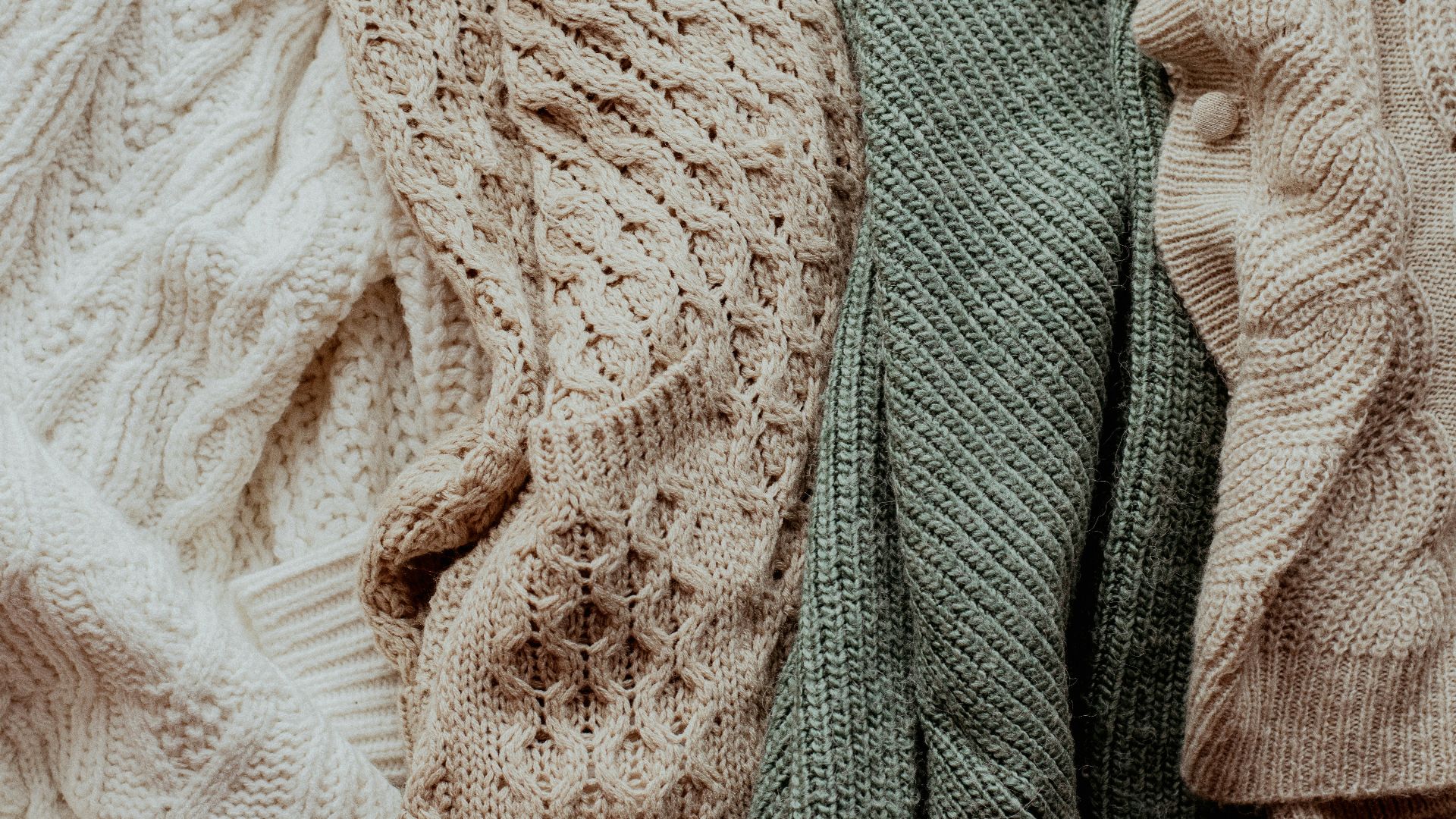 a pile of sweaters sitting next to each other