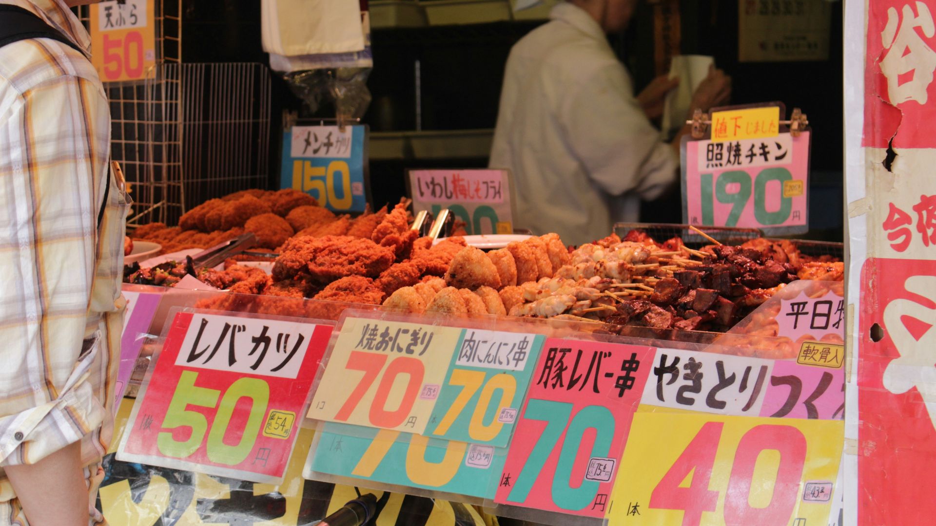 assorted foods displayed in booth near people