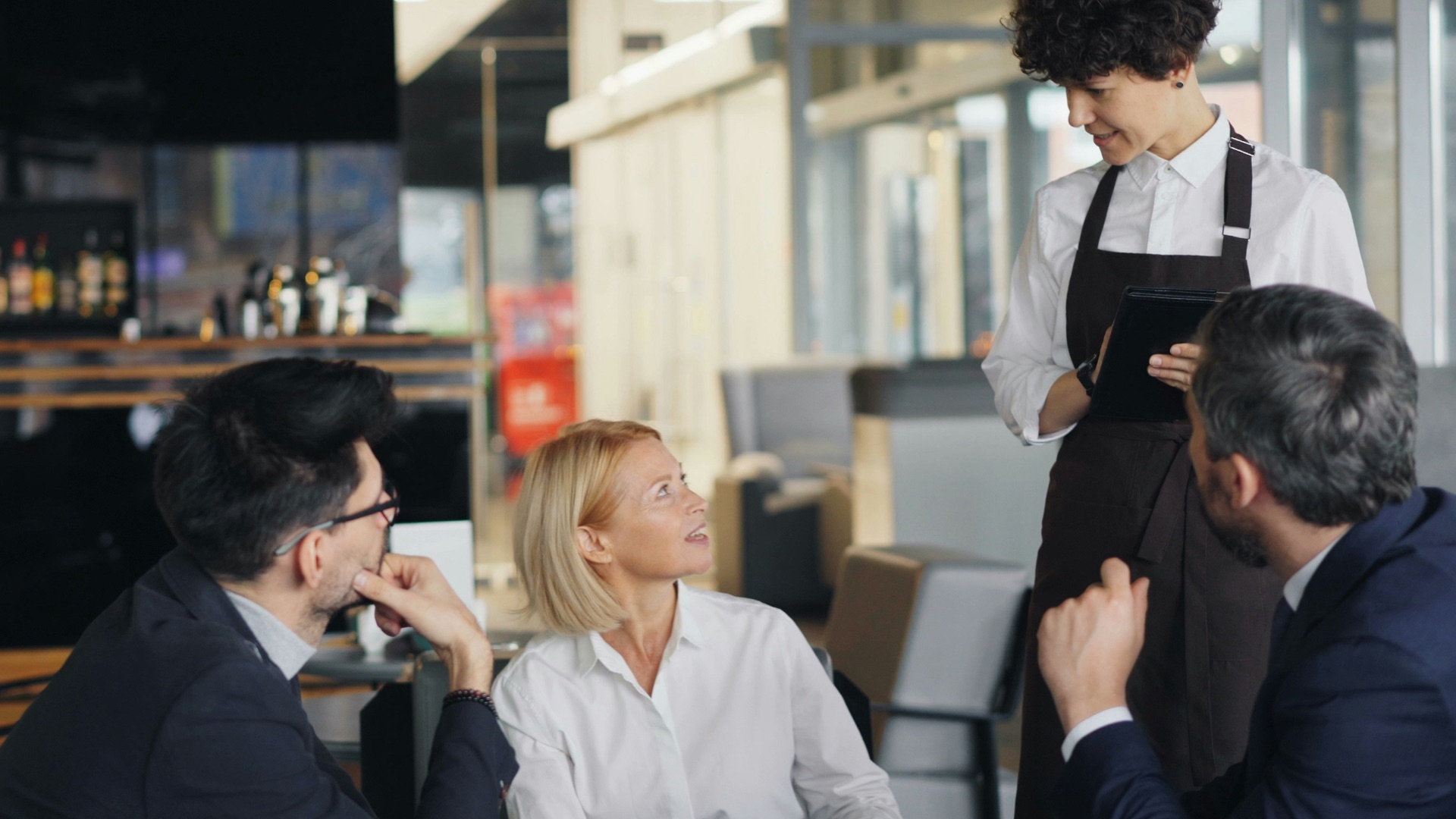 a group of people sitting around a table