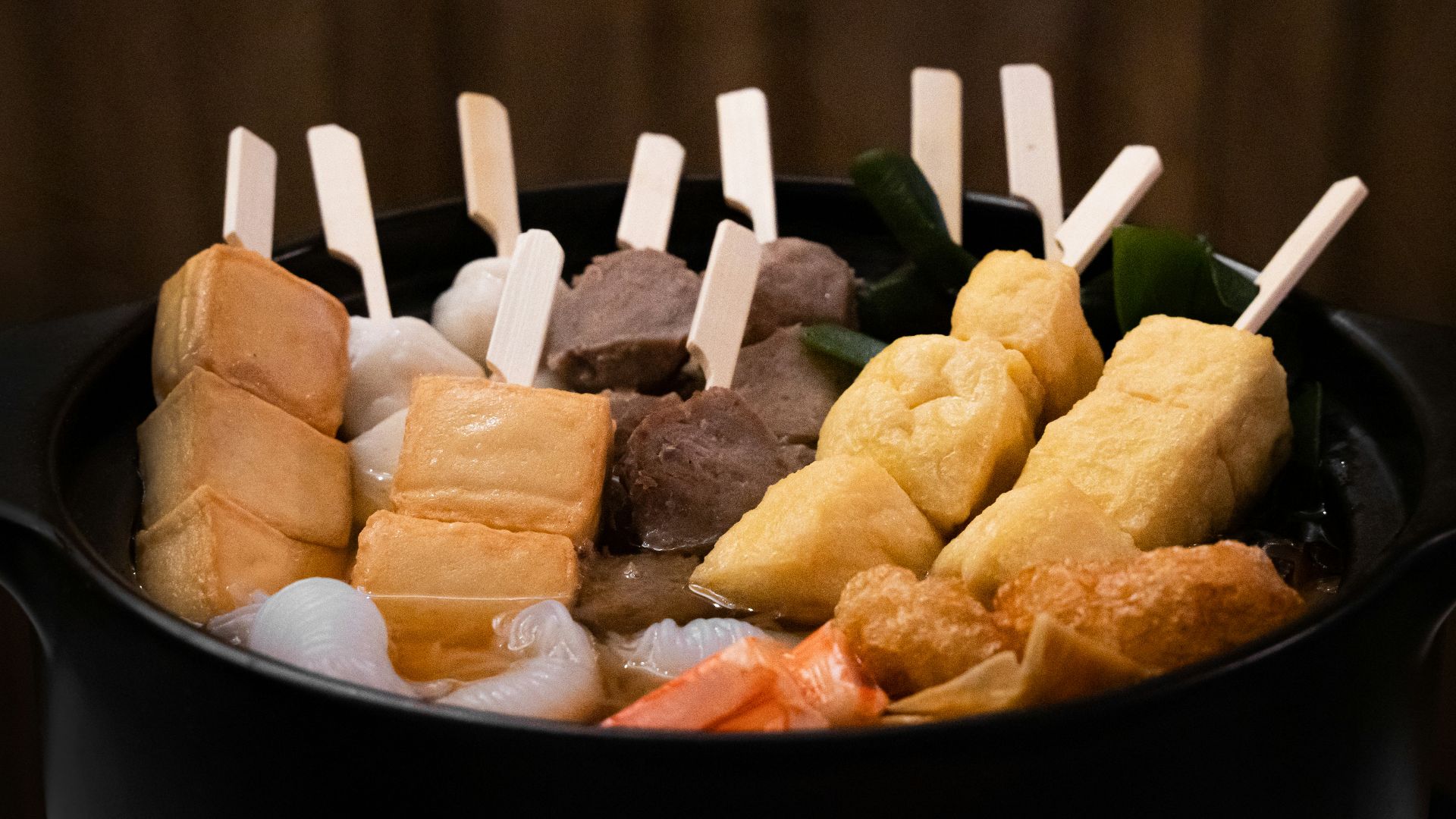 brown food on black bowl