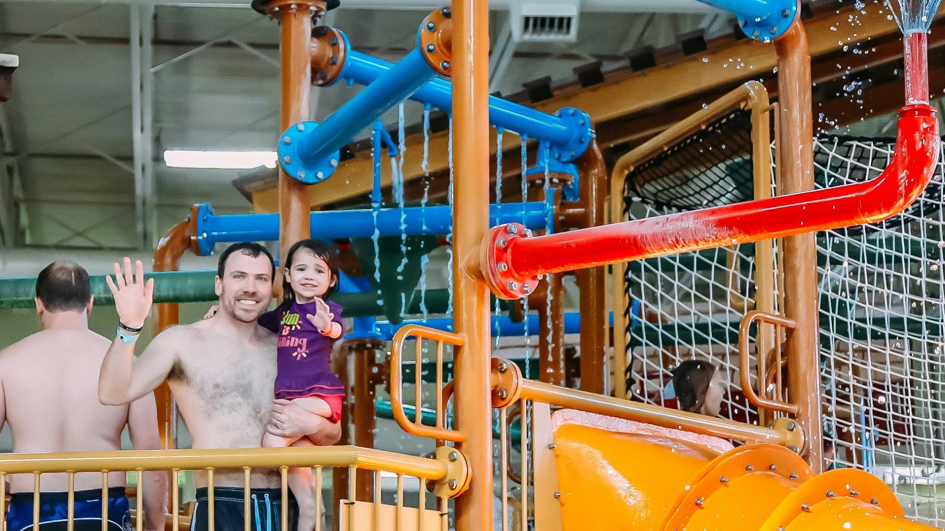 a group of people playing in a water park