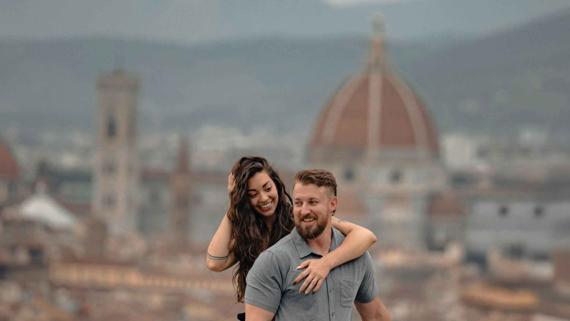Couple embracing with florence cityscape background