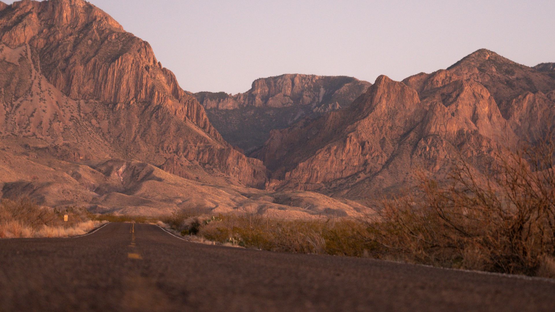 a view of a mountain range from a road