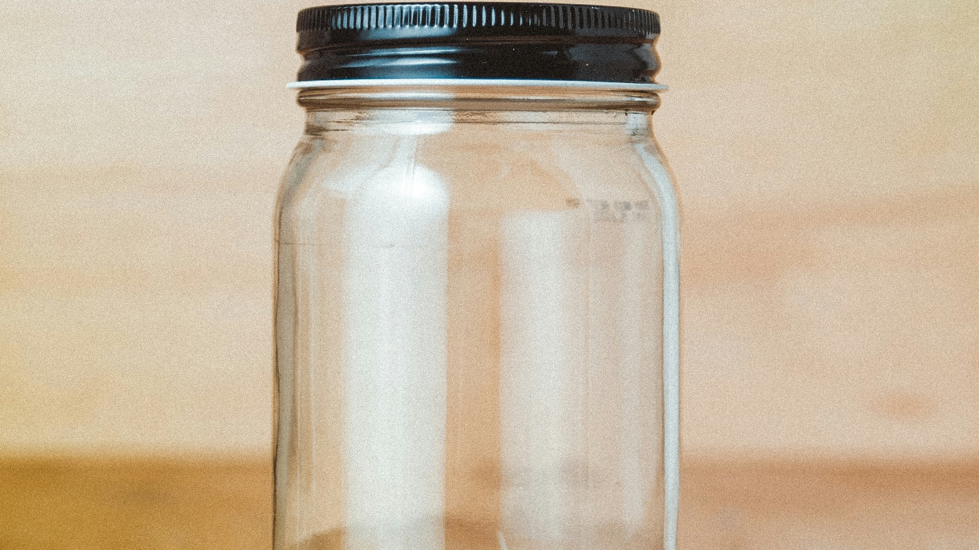 clear glass jar with white powder inside