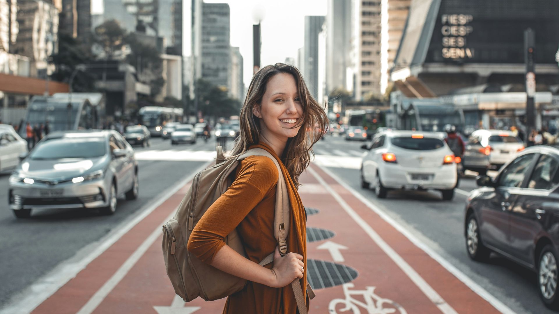 woman standing on middle of road