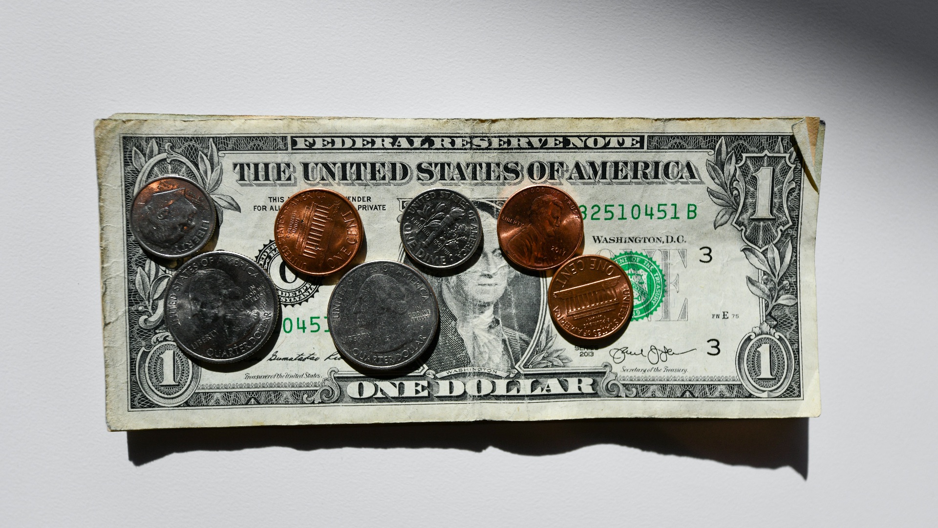 silver and gold round coins in box