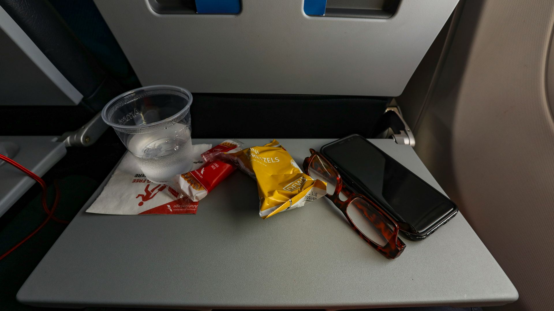 a table with a cell phone and some snacks on it
