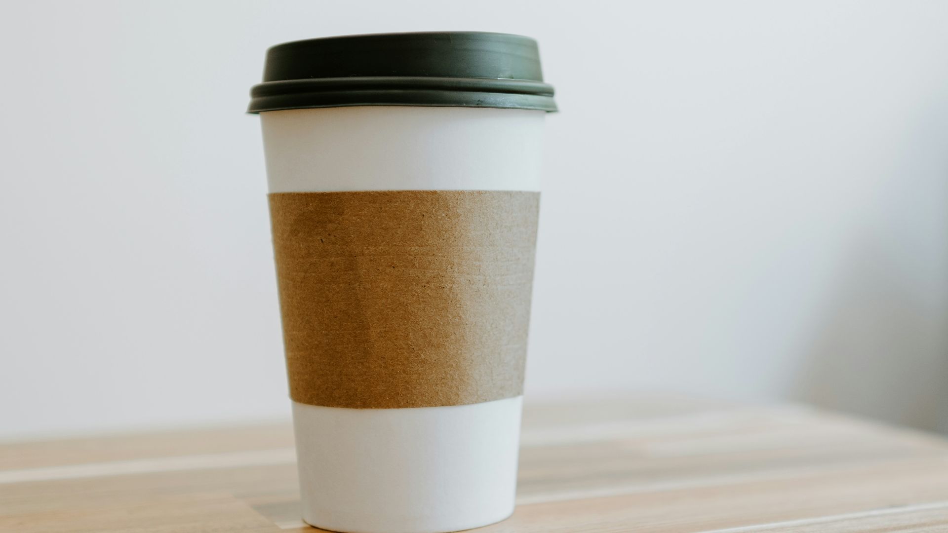 white and brown paper cup