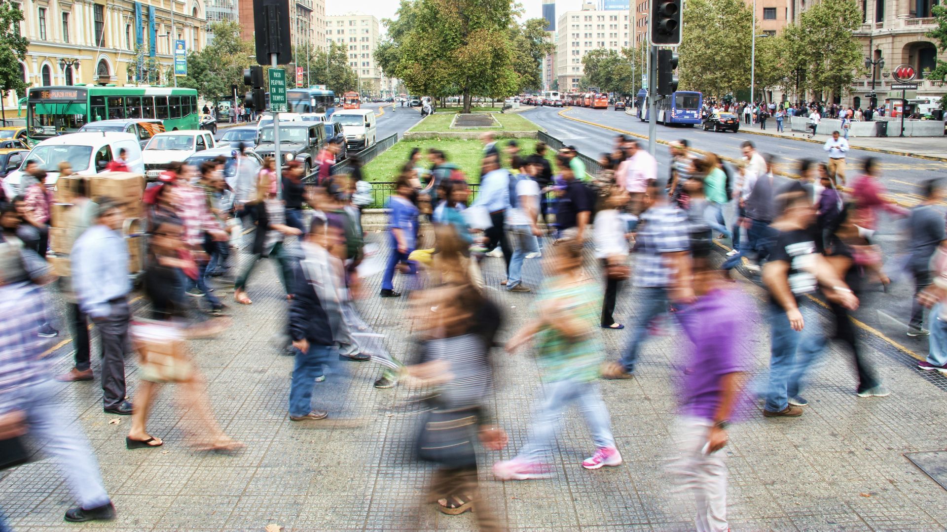 timelapse photo of people passing the street