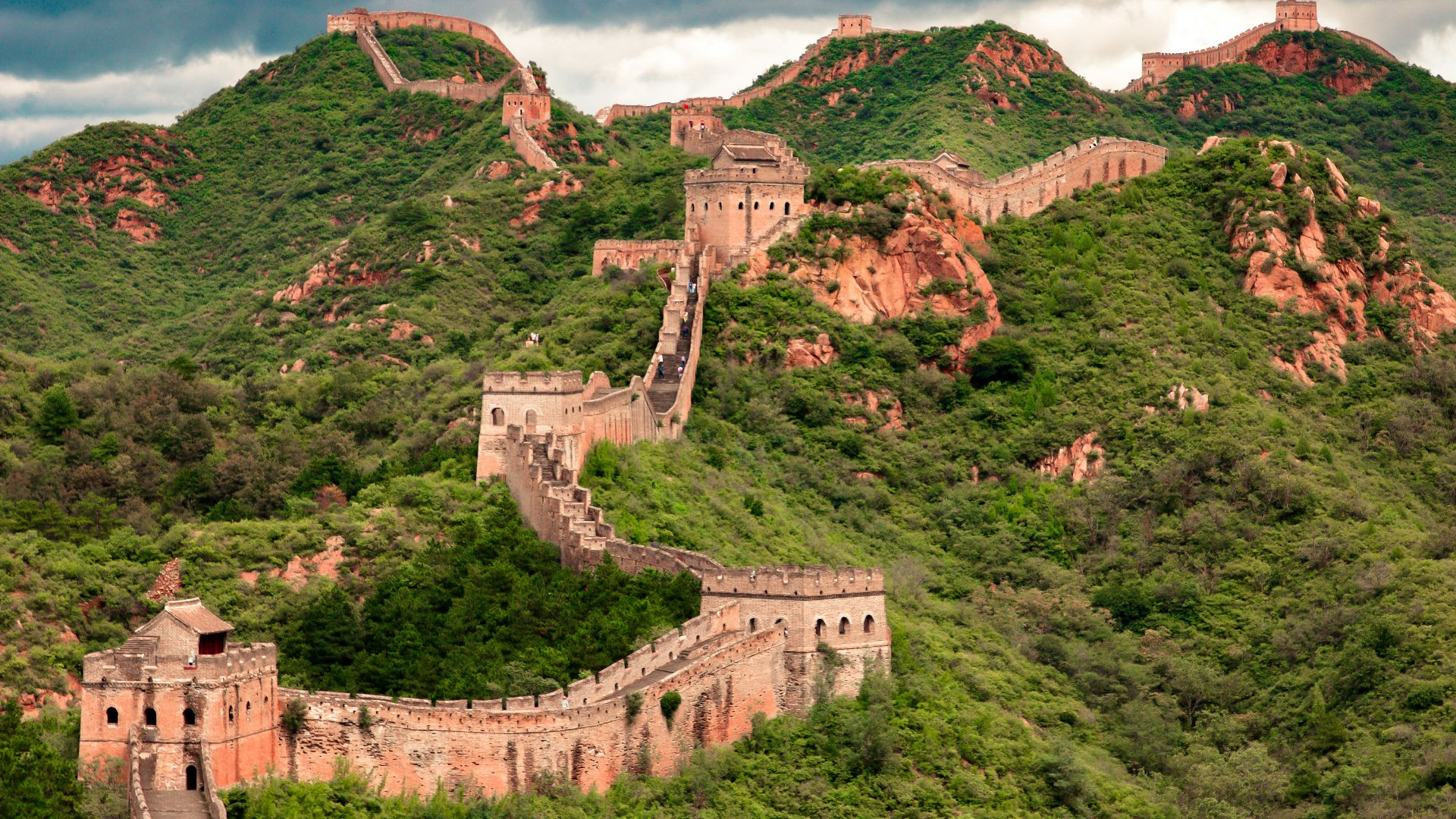 brown concrete building on top of hill