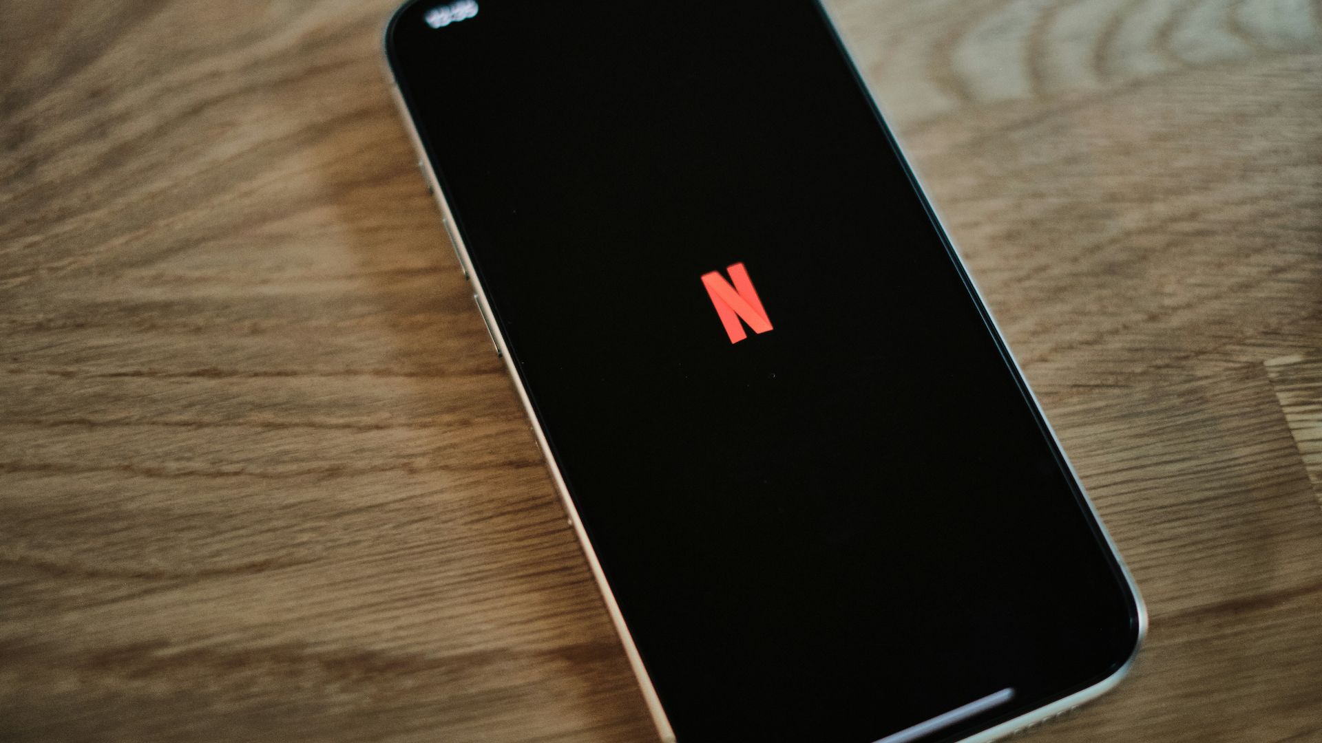 A close up of a cell phone on a table