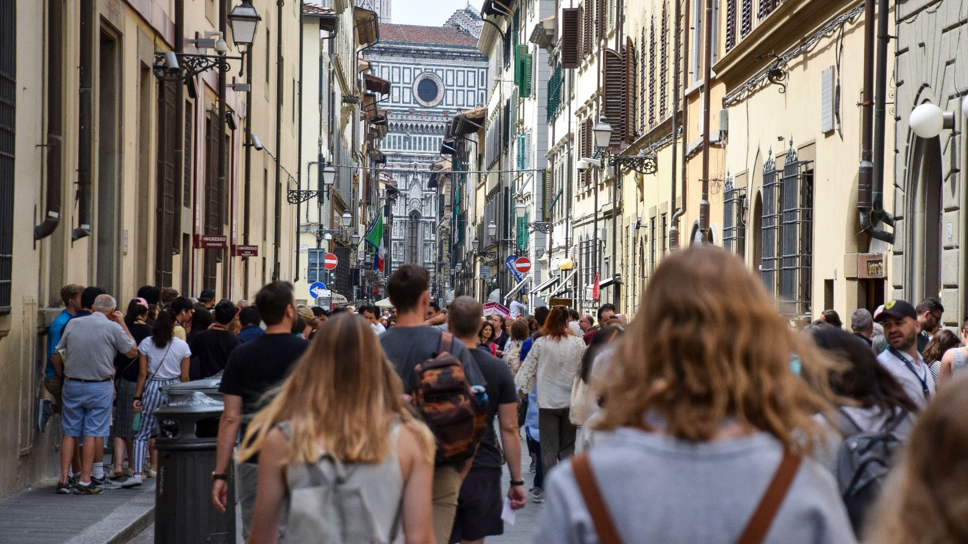 people walking on building alley