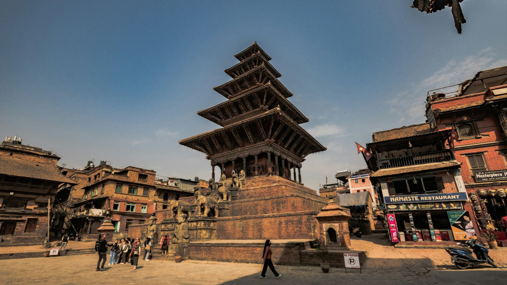 a very tall building sitting in the middle of a town