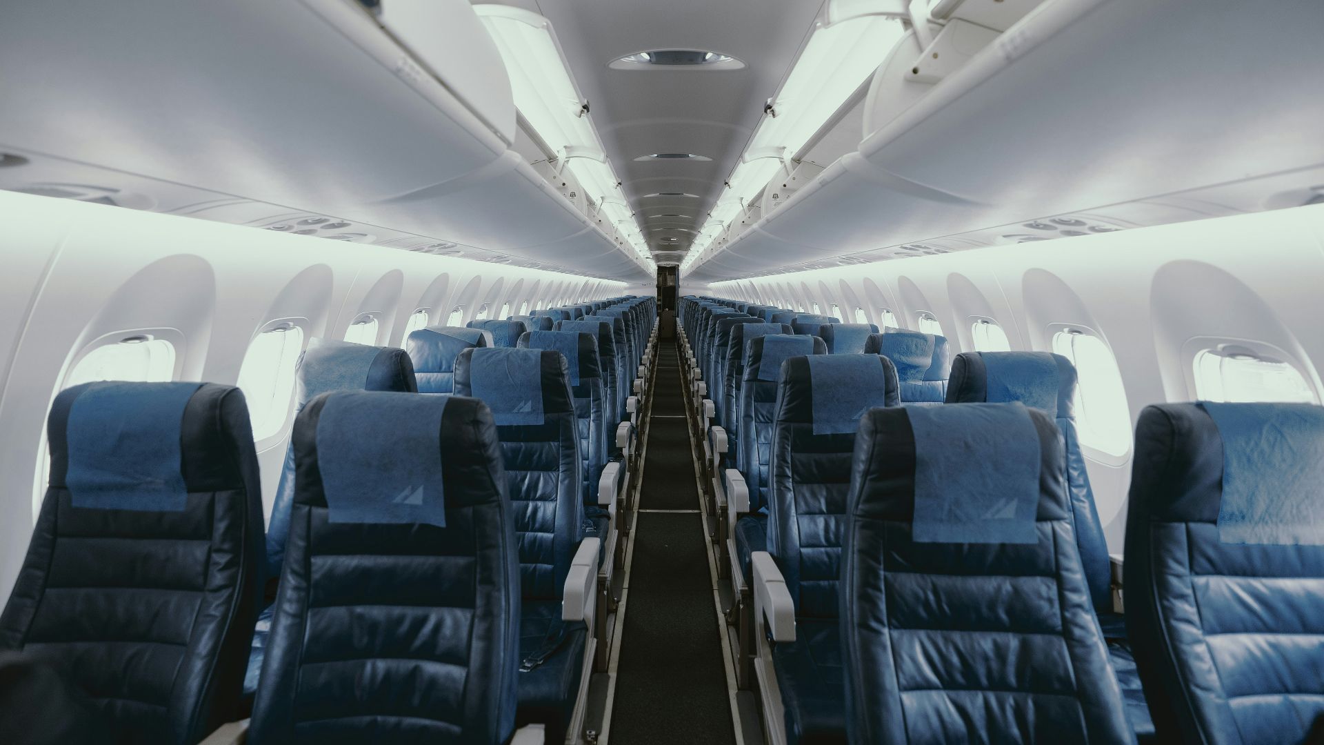blue airplane interior with seats