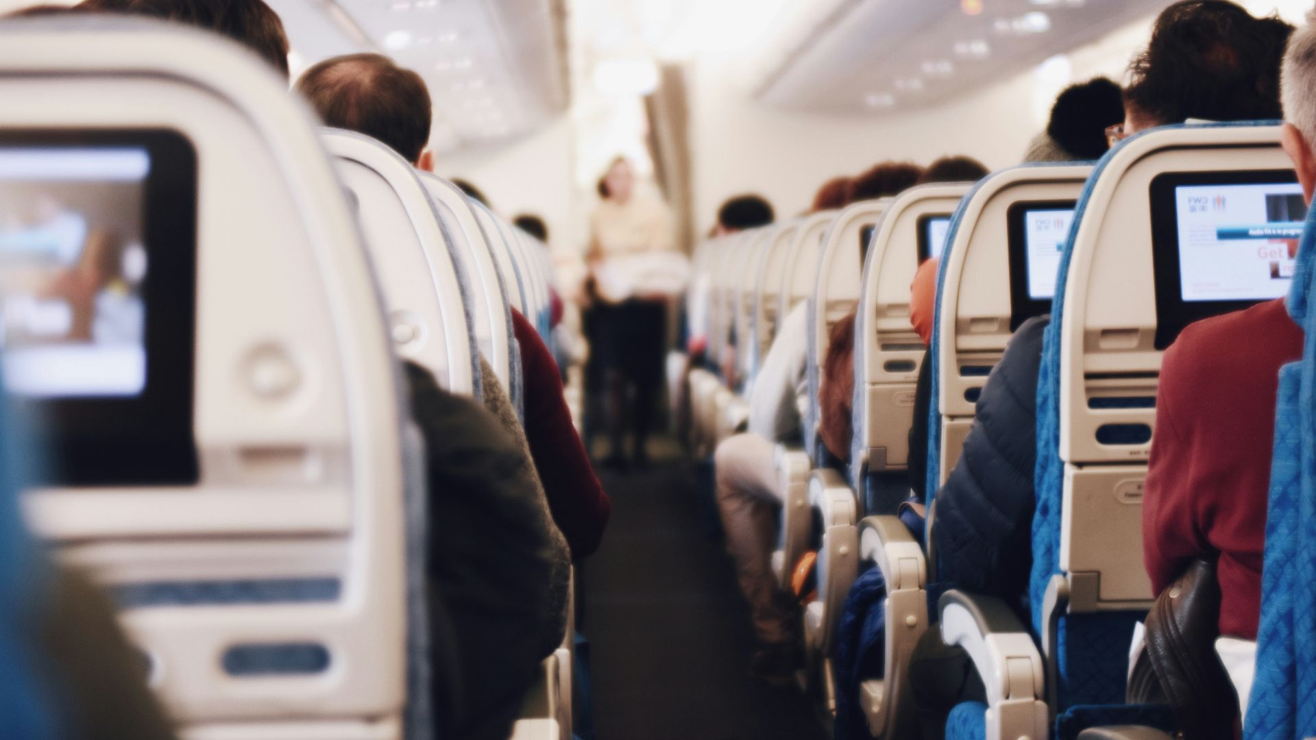 shallow focus photography of people inside of passenger plane