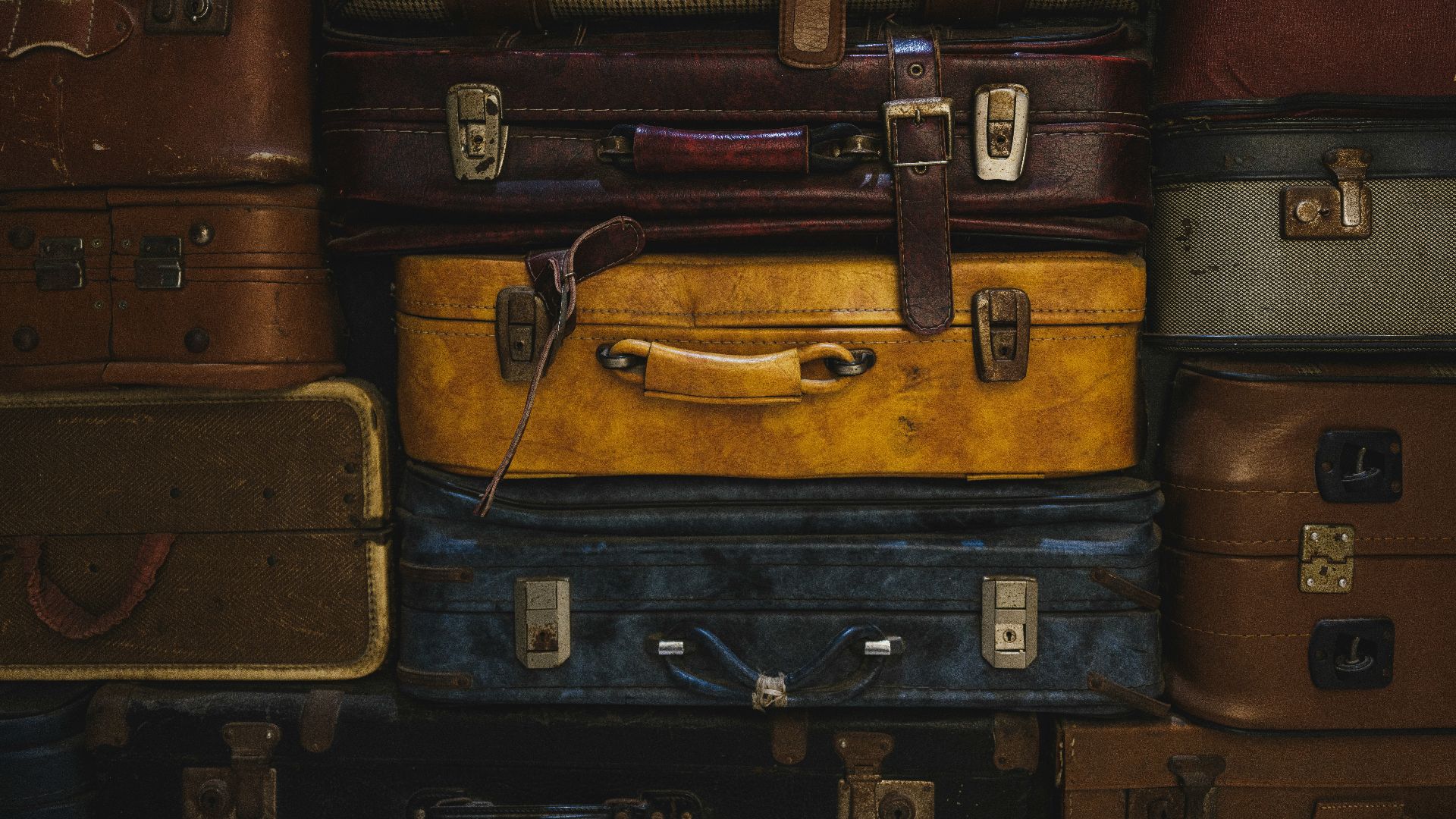 Stack of vintage suitcases in various colors