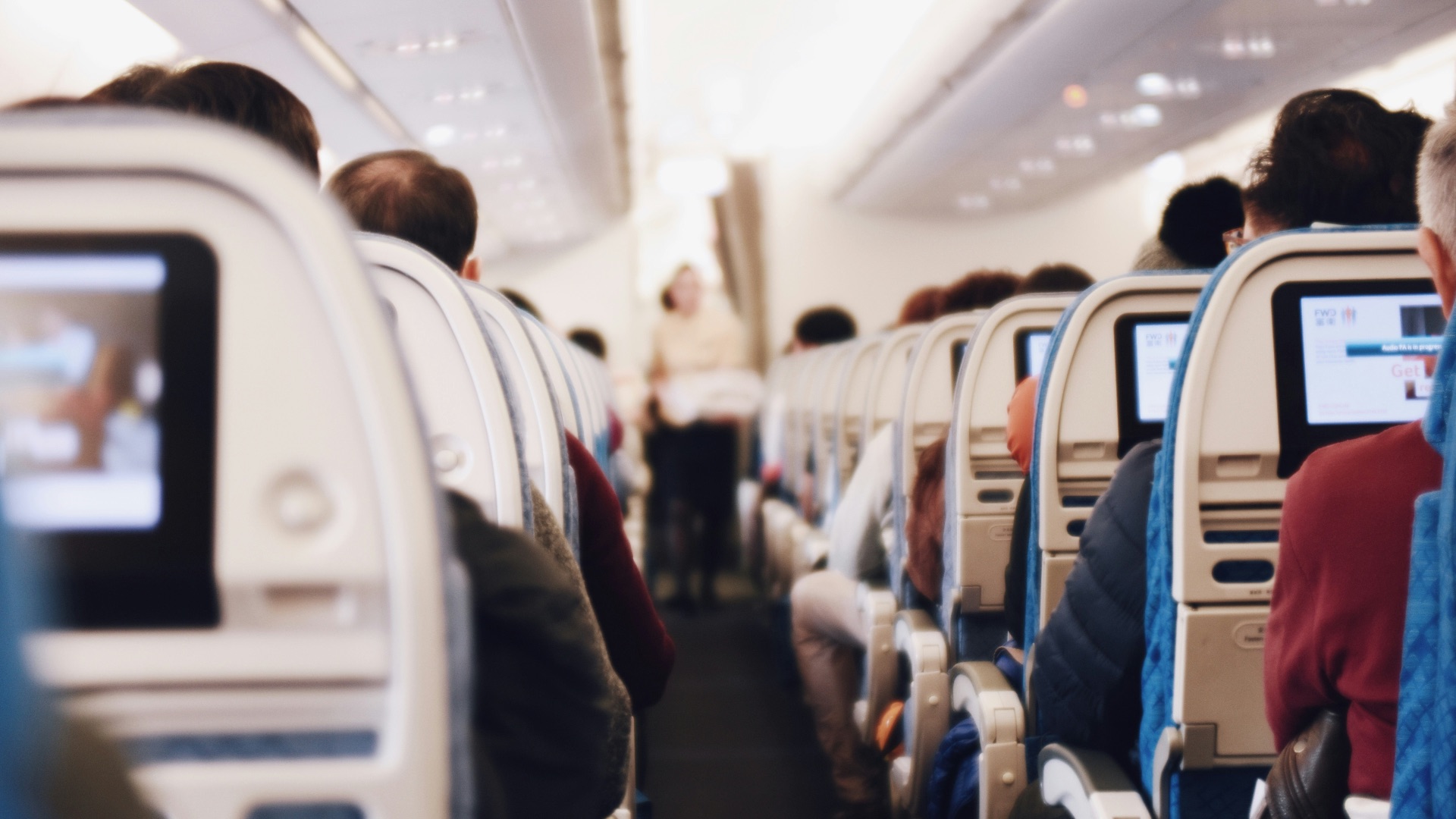 shallow focus photography of people inside of passenger plane