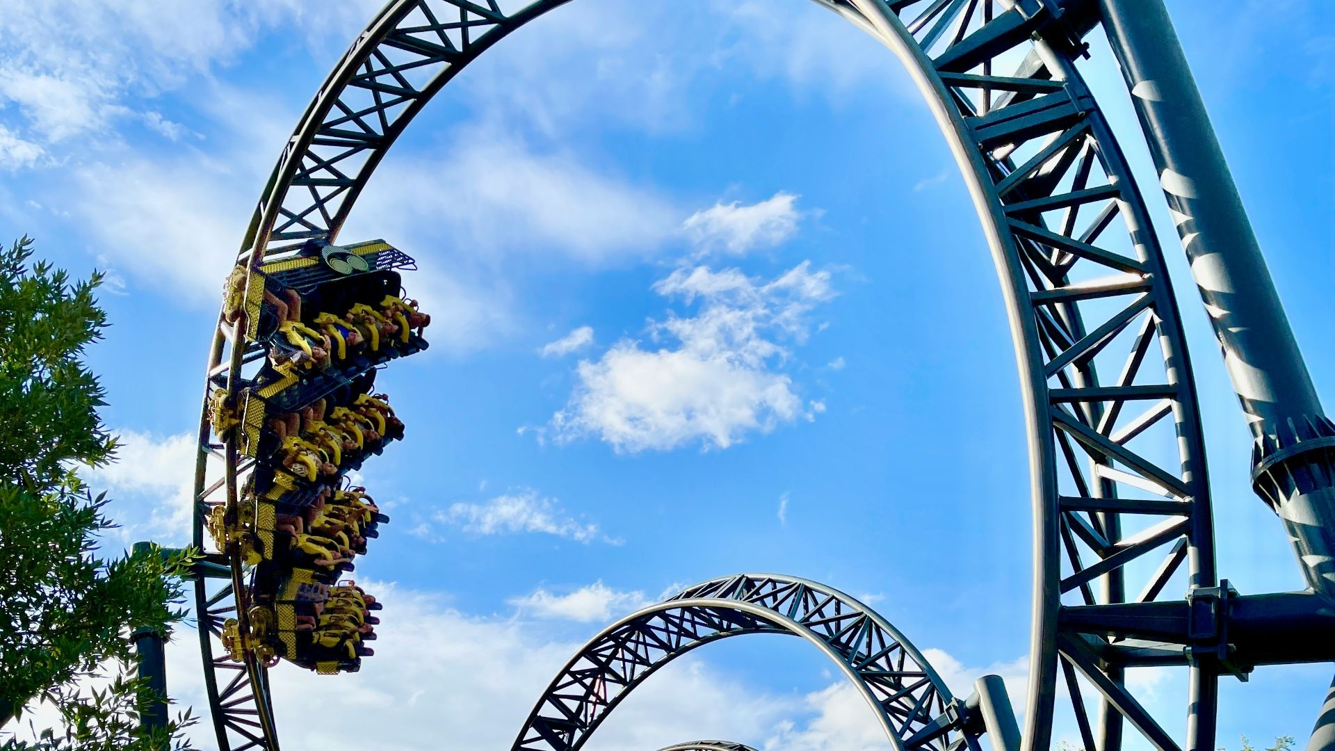 green and brown roller coaster under blue sky during daytime
