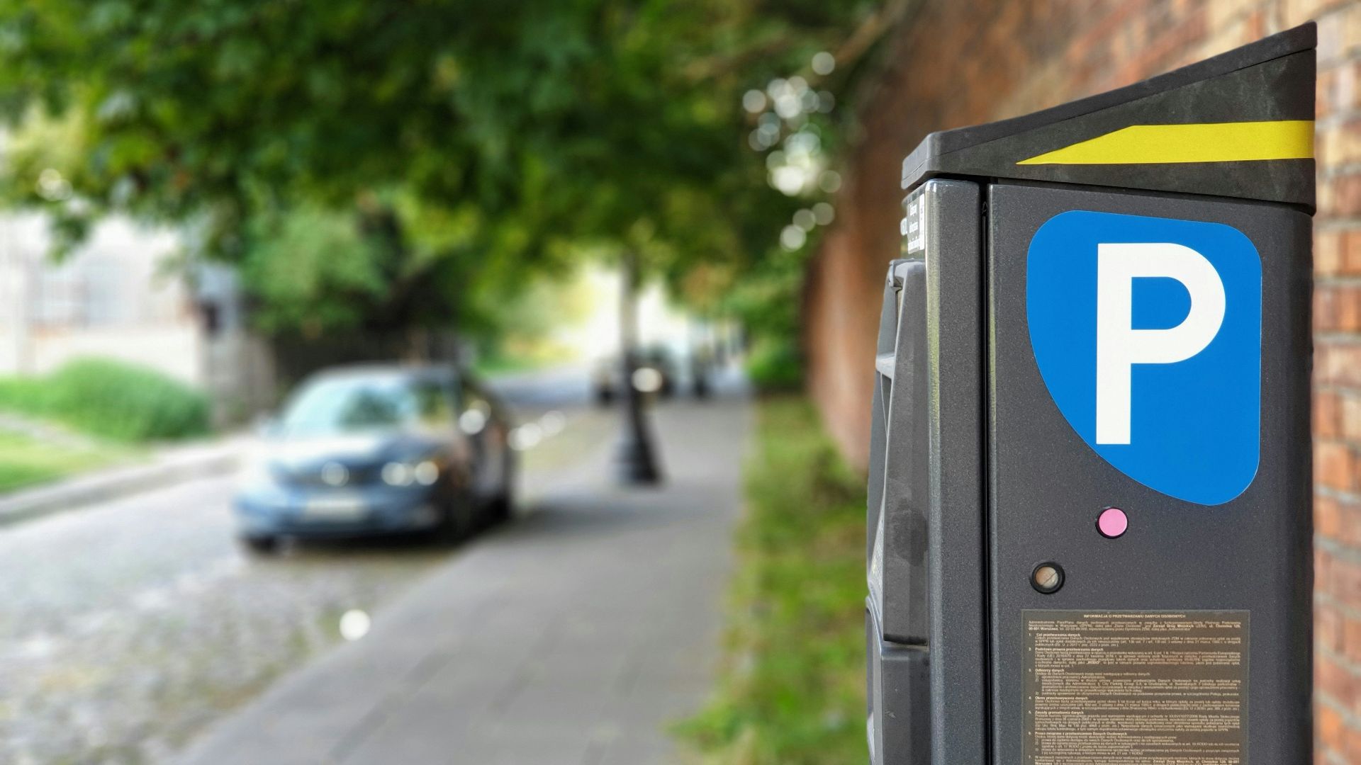 black car parked on sidewalk during daytime