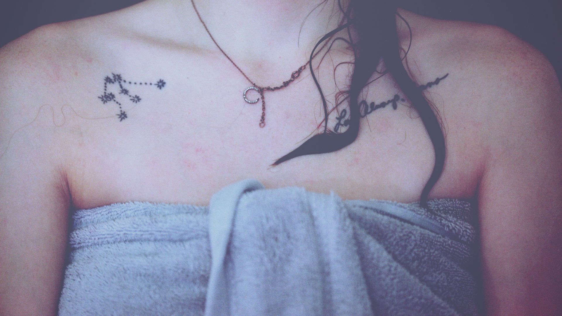 woman wrapping gray towel