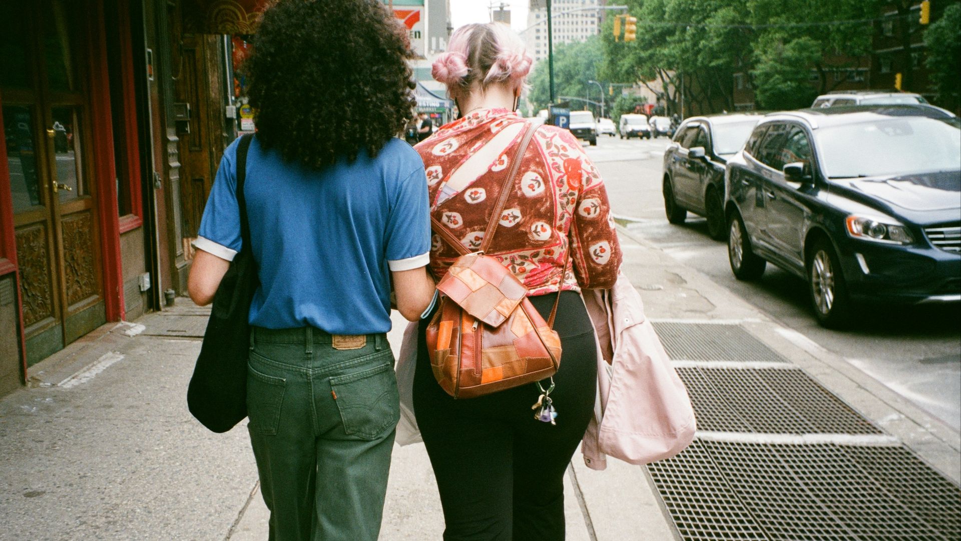 a man and a woman walking down the street