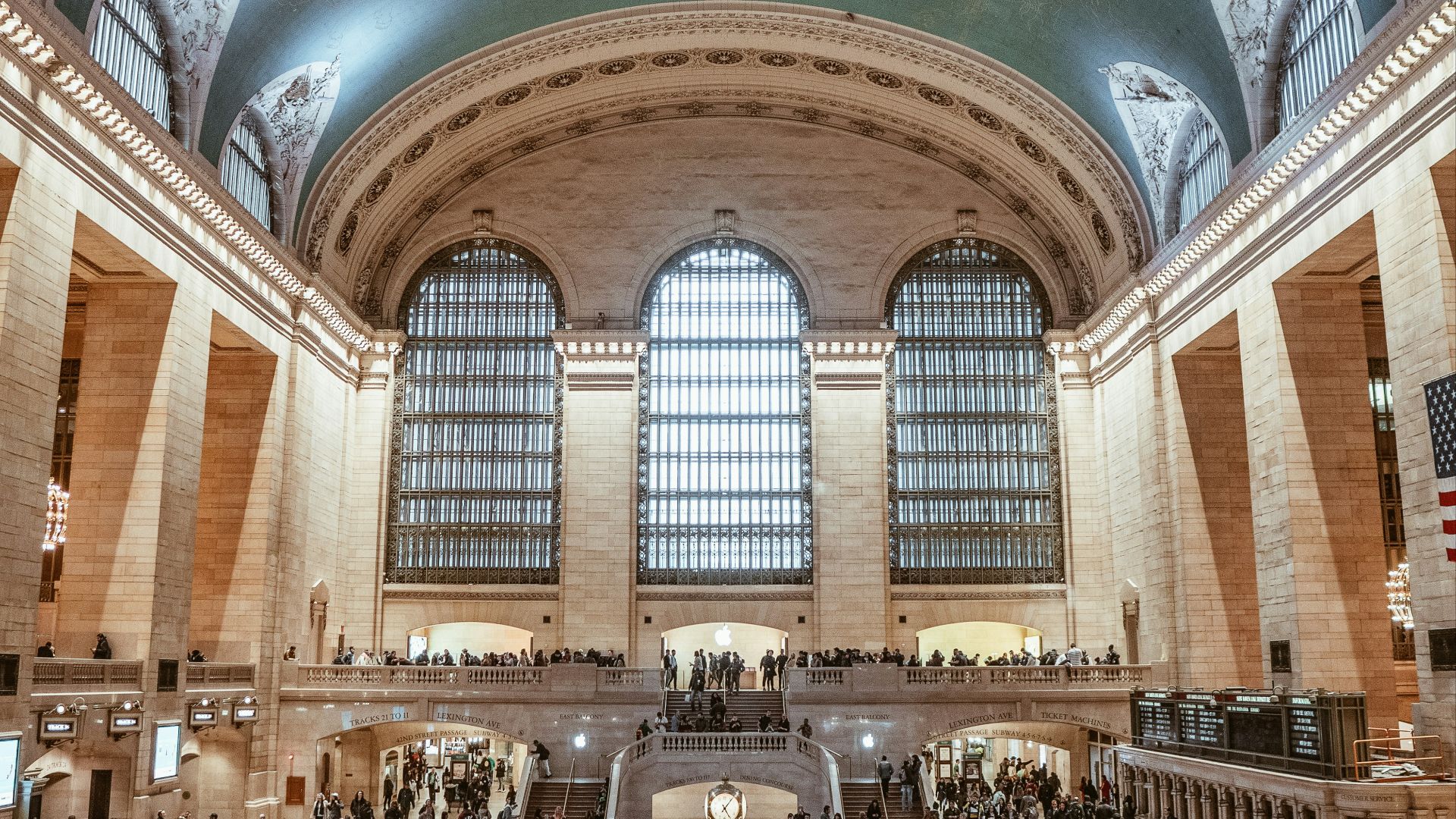 people standing under musuem