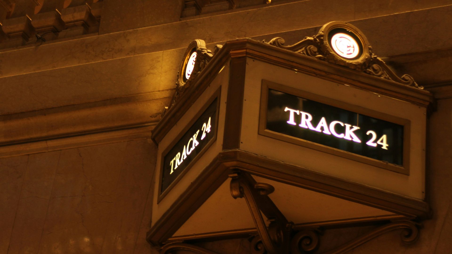 a clock tower with a weather vane